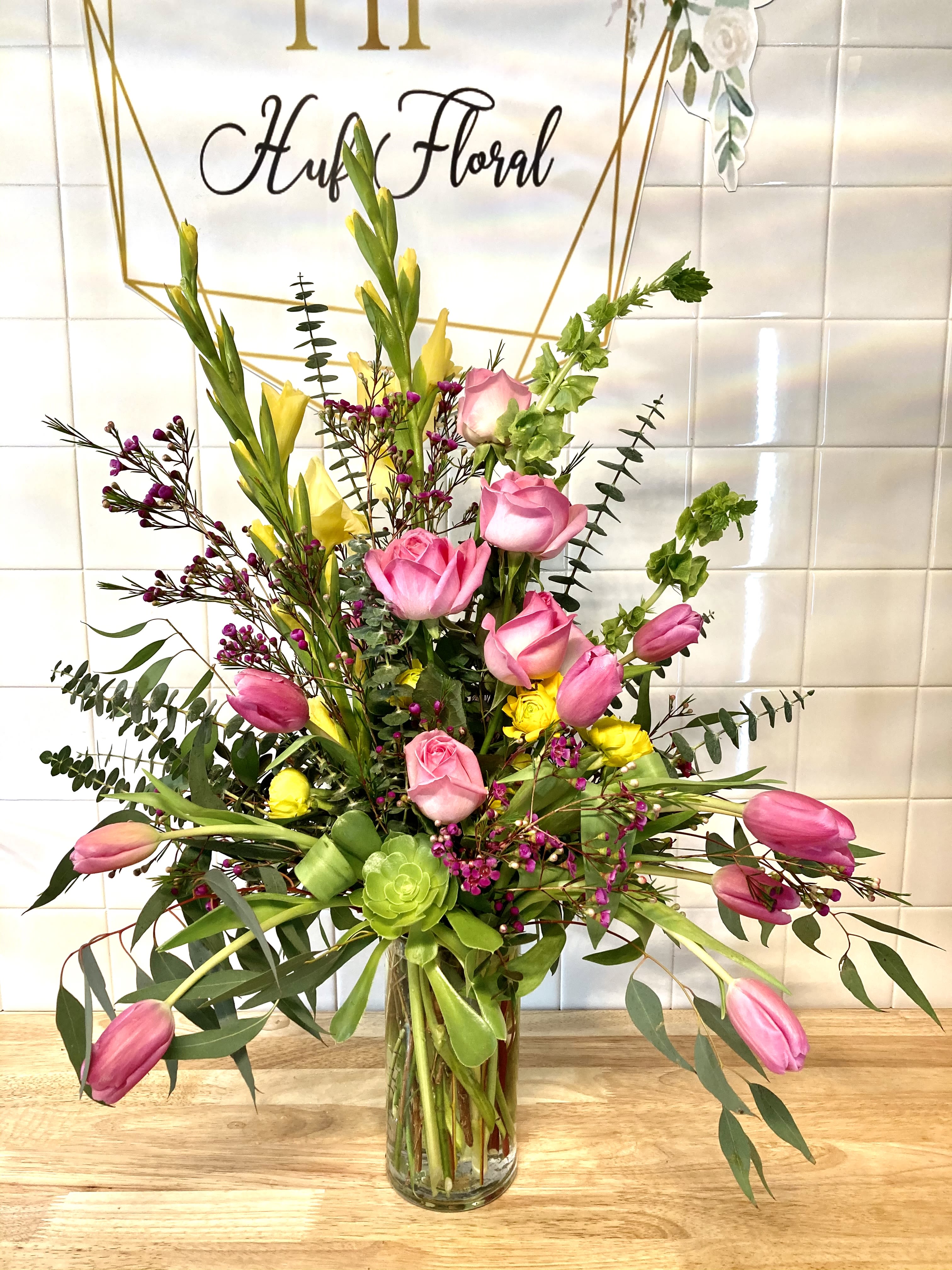 A Beautiful Morning A Beautiful Morning - Everything about this arrangement is just so cheerful, bright and fresh! Brighten anyone's day with this gorgeous display of locally grown roses, tulips and gladiolas. Share A Beautiful Morning with someone you care about today!