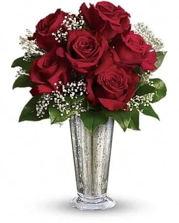Teleflora's Kiss of the Rose - True love. Sweet love. Beautiful love. Celebrate all flavors of love with this elegant arrangement of roses hand-delivered in a stunning silver Mercury Glass Vase. Six ravishing red roses mixed with gypsophila and greens are arranged in a Mercury Glass Antique vase. Send this kiss of bliss! 