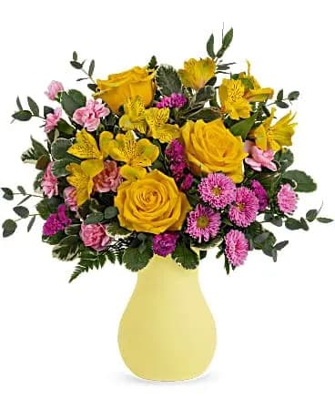 Teleflora's Happy As Can Be Bouquet - Pure happy! Brighten any day with this joyful bouquet of yellow roses and pink blooms, arranged in a fabulous frosted glass vase. Yellow roses, yellow alstroemeria, miniature pink carnations, pink matsumoto asters and raspberry sinuata statice are arranged with variegated pittosporum, leatherleaf fern and parvifolia eucalyptus. Delivered in Teleflora's Serendipity Glass Vase. 