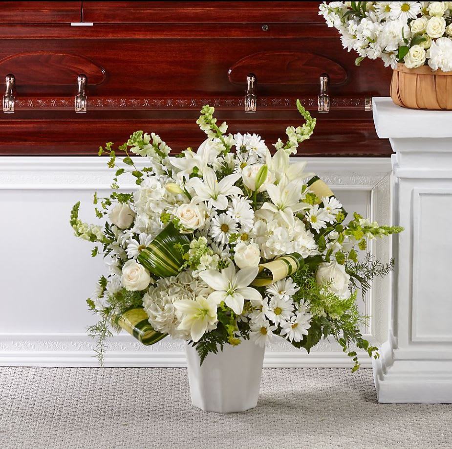 Thoughts of Tranquility™ Floor Basket Thoughts of Tranquility™ Floor Basket - Comfort, beauty and grace come together in this stunning display of serene blooms. Our Thoughts of Tranquility™ Floor Basket is handcrafted by a local florist with ivory roses and white hydrangea, snapdragons and lilies to show how much you care. GOOD bouquet is approximately 30"H x27"W. BETTER bouquet is approximately 32"H x 32"W.