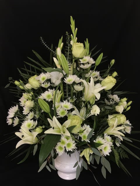 Traditional White Urn Basket - Beautiful white flowers arranged in an urn basket