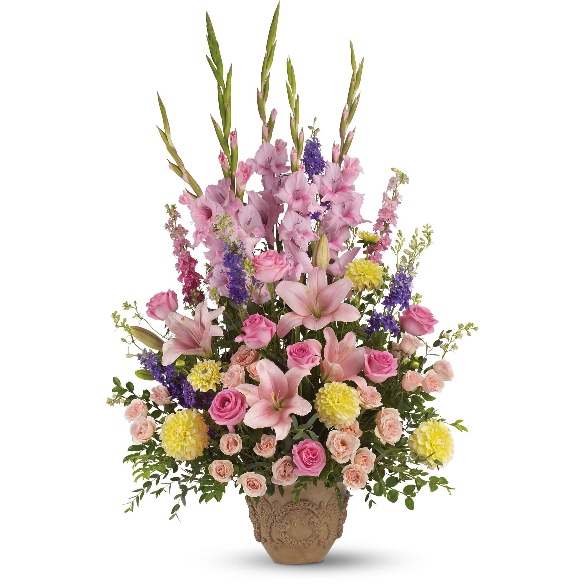 Ever Upward Bouquet by Teleflora - Not at all somber are these abundant blooms of pink, yellow and lavender, gracefully arranged in a container that is equally suitable for a memorial service or one's home. 