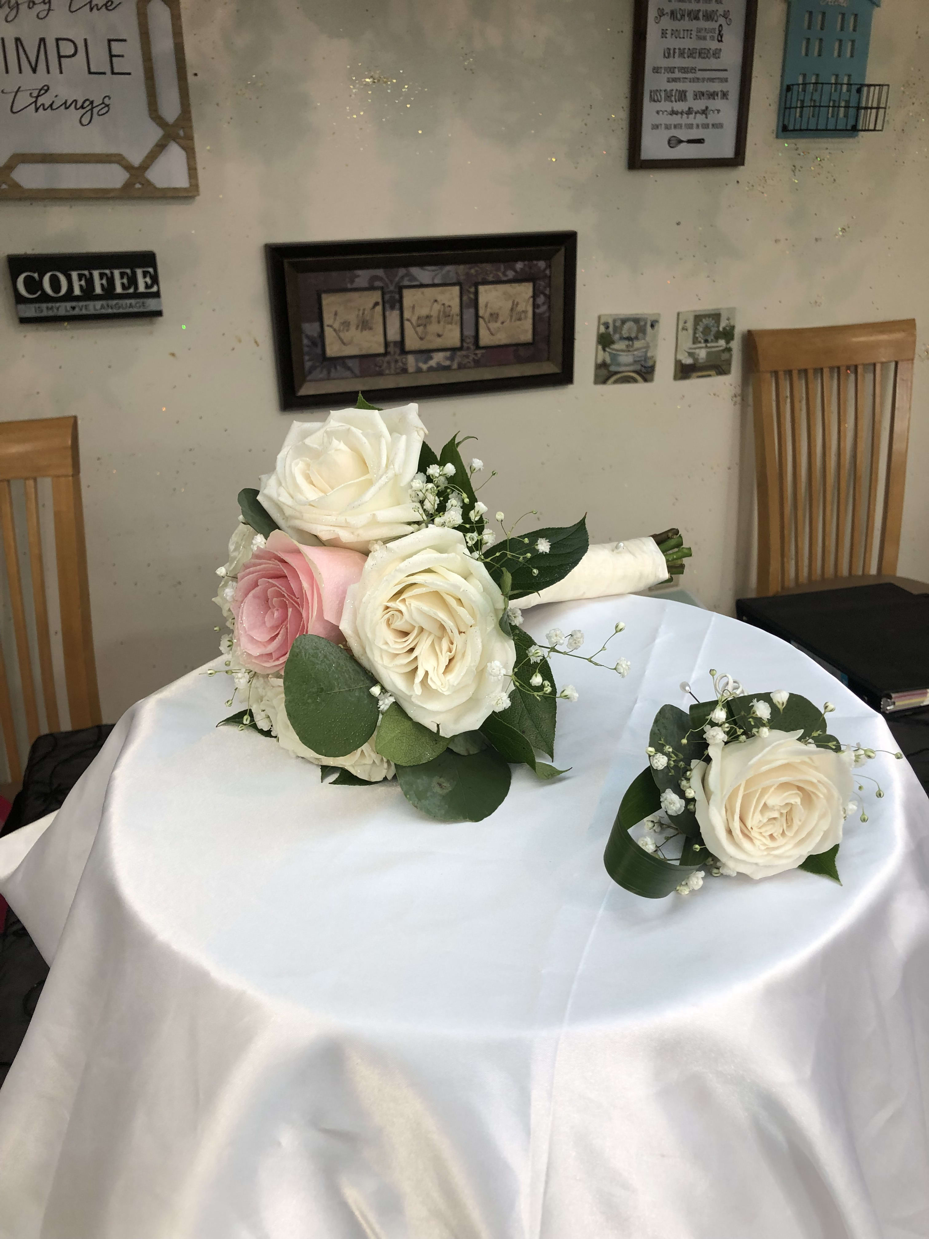 Bridesmaid Bouquet and Boutonniere. Bridesmaid Bouquet and Boutonniere. - Roses, baby's breath and greenery.