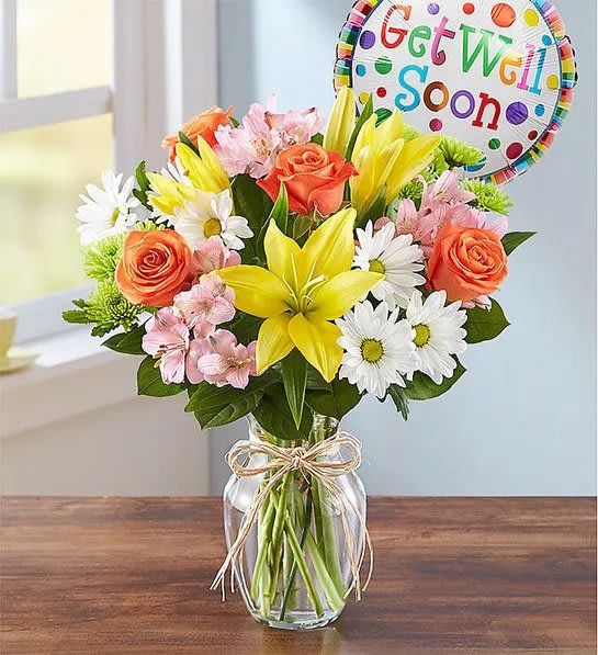 Fields Of Europe® Get Well - Lift someone’s spirits with a cheerful bouquet inspired by the gardens of Europe. Artistically gathered inside a glass v ase accented with raffia, and paired with a colorful Get Well balloon, it’s the perfect prescription for a happy heart and a speedy recovery.