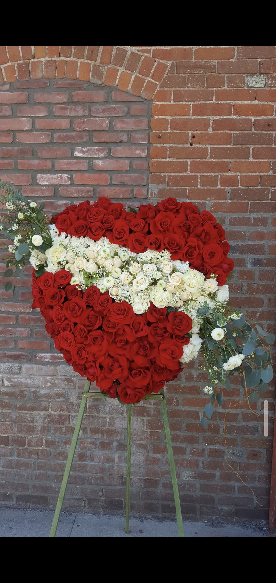 broken hearts broken hearts - composed of 5 dozen red roses and 1 dozen white roses with fillers and greenery