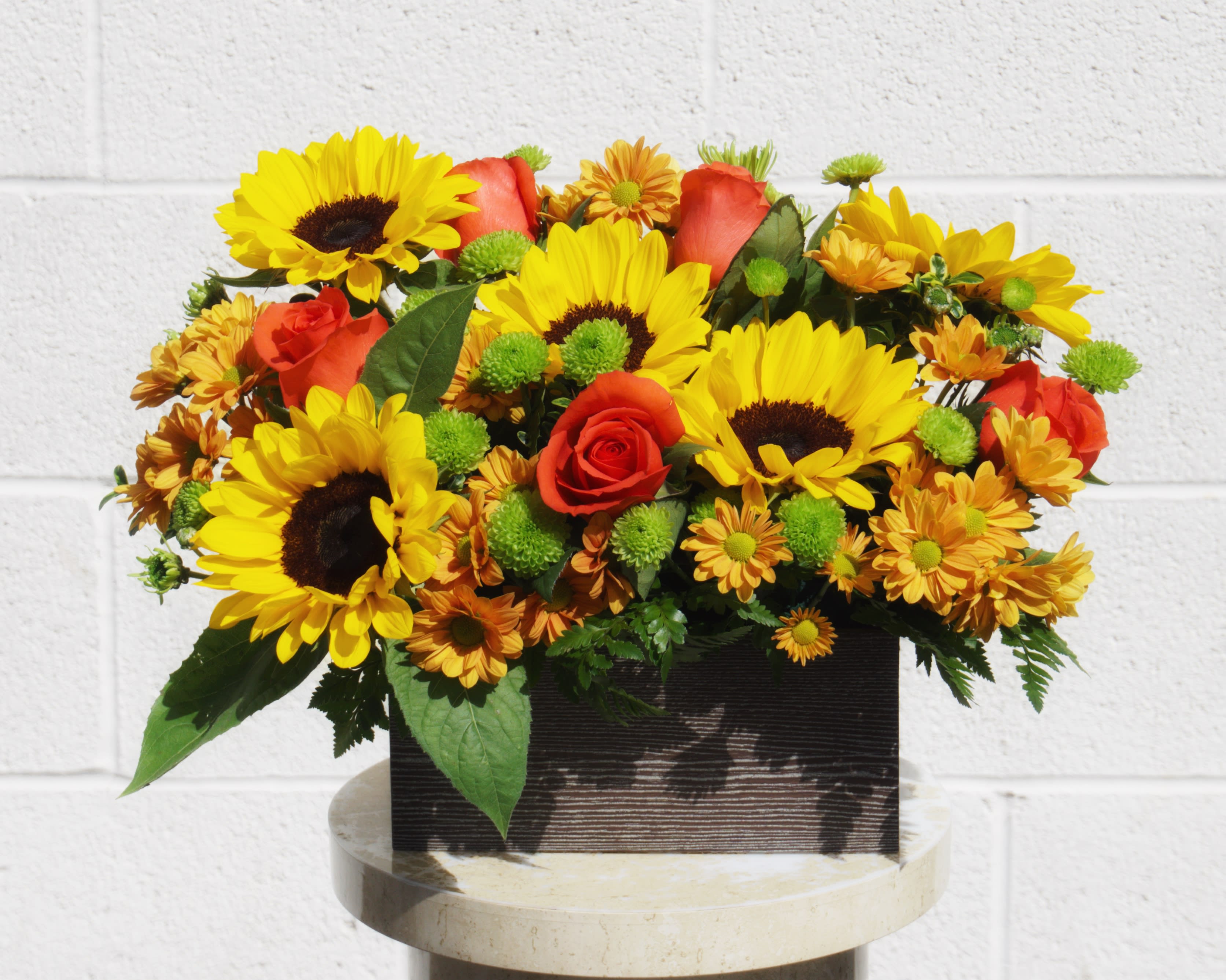 Box of Sunshine - Wood box full of sunflowers, roses and nice accents. STANDARD: FIRST PHOTO DELUXE: SECOND PHOTO PREMIUM: THIRD PHOTO