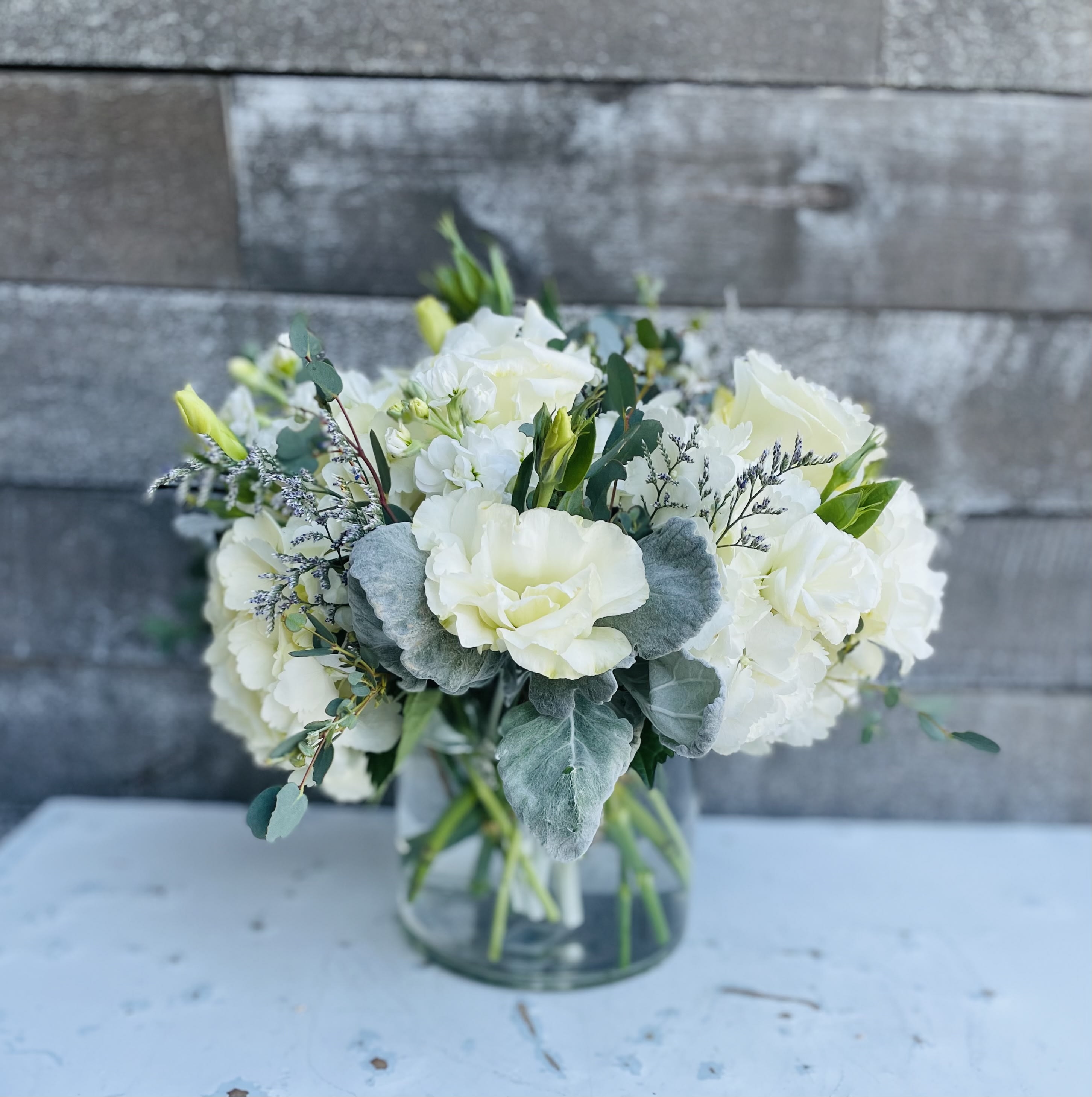 Nobility - White and dusted leaves with greens and white roses