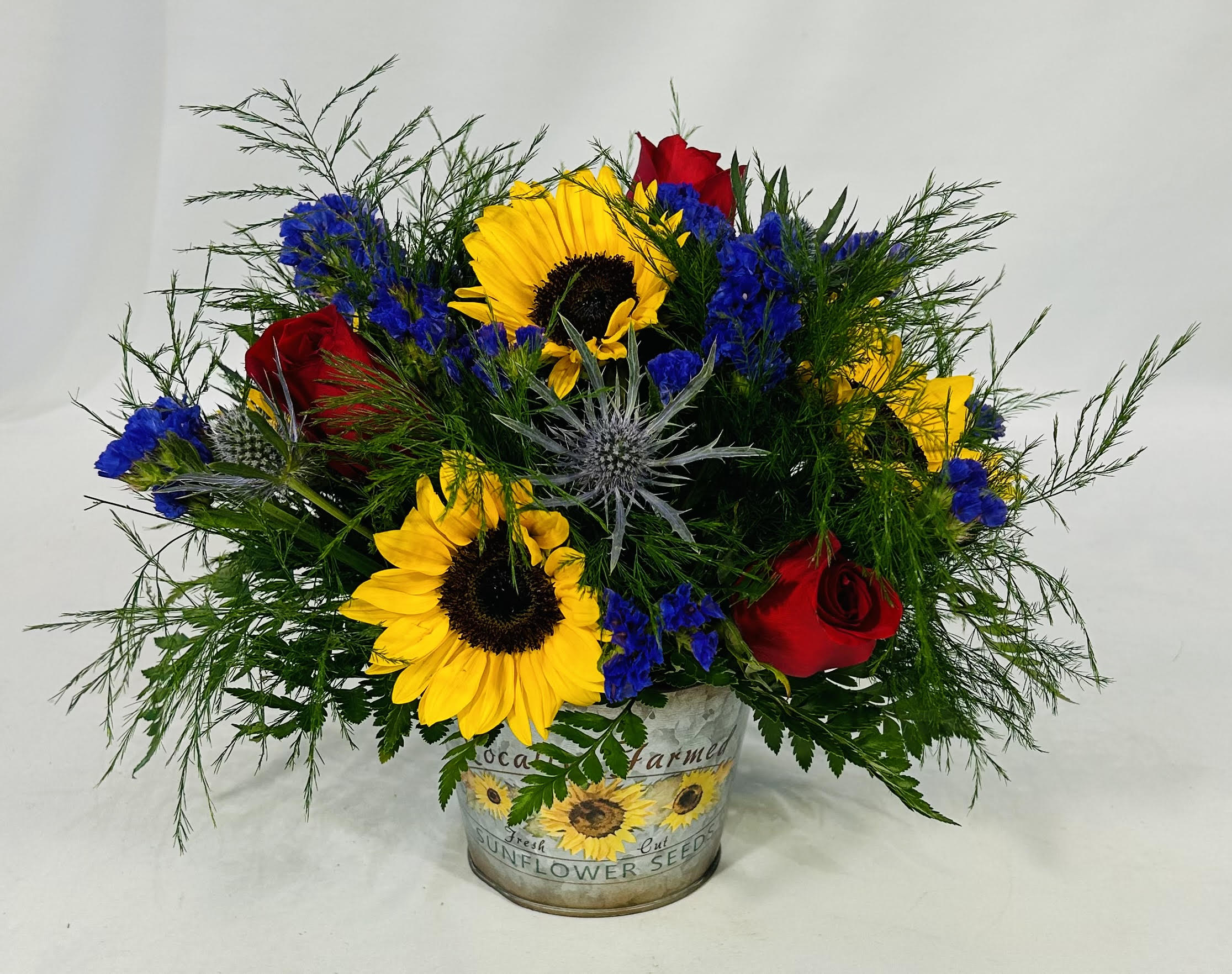 Sunflower Dreams  - Perfect sunflower and red rose arrangement for any occasion. This cute arrangement is perfect for a birthday, just because, get well or to just simply put a smile on someone's face to brighten their day. 
