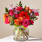 Fiesta - The Fiesta Bouquet is composed of a lively mix, fit to celebrate any and every moment. With a combination of vibrant flowers, this florist–designed arrangement brings a pop of color and a burst of excitement as soon as it arrives.  Please Note: The bouquet pictured reflects our original design for this product. While we always try to follow the color palette, we may replace stems to deliver the freshest bouquet possible, and we may sometimes need to use a different vase.