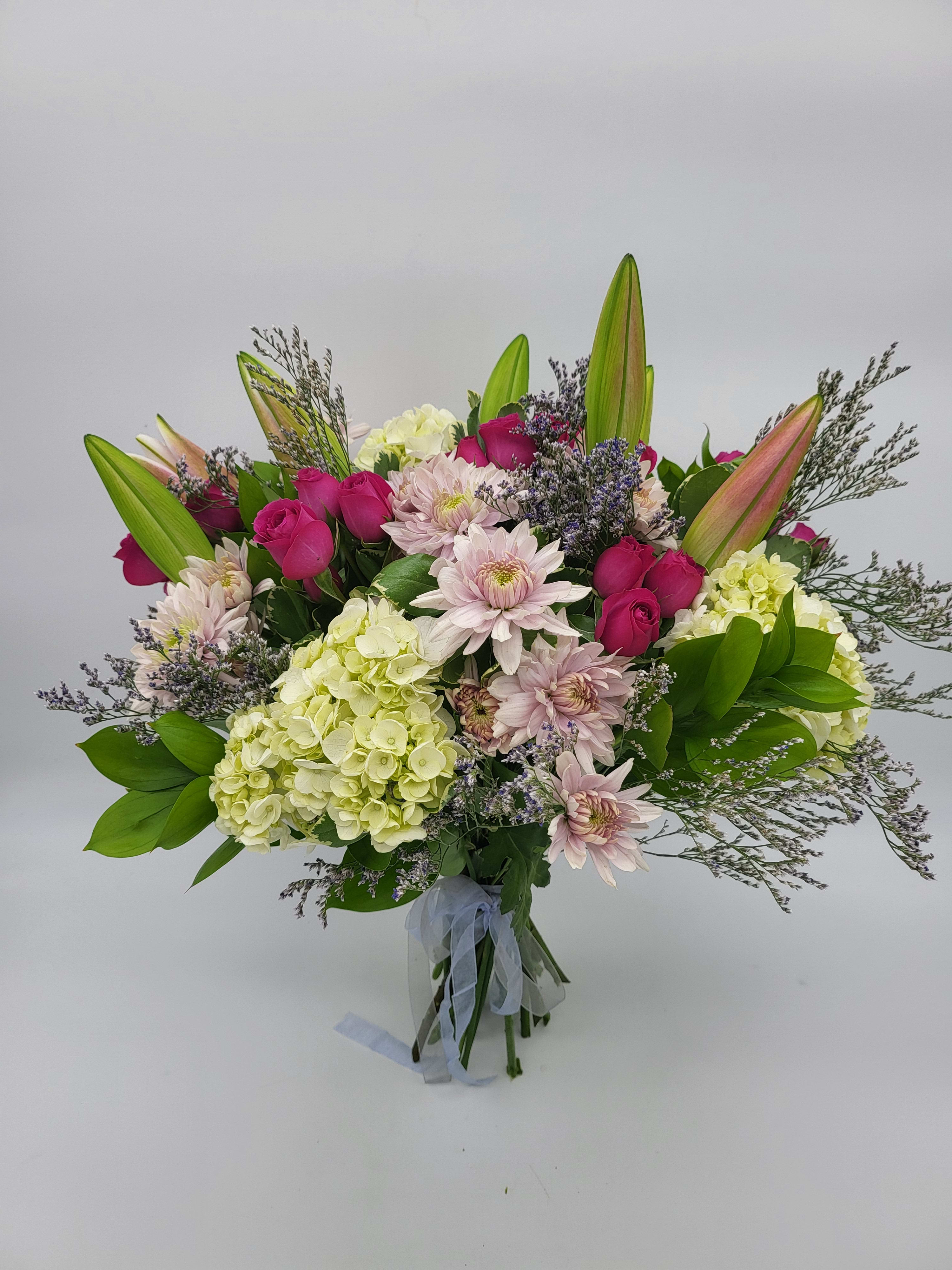Hand Tied Bouquet - Enjoy the best of the best for any occassion!  Please add specific colors or flowers in special instruction