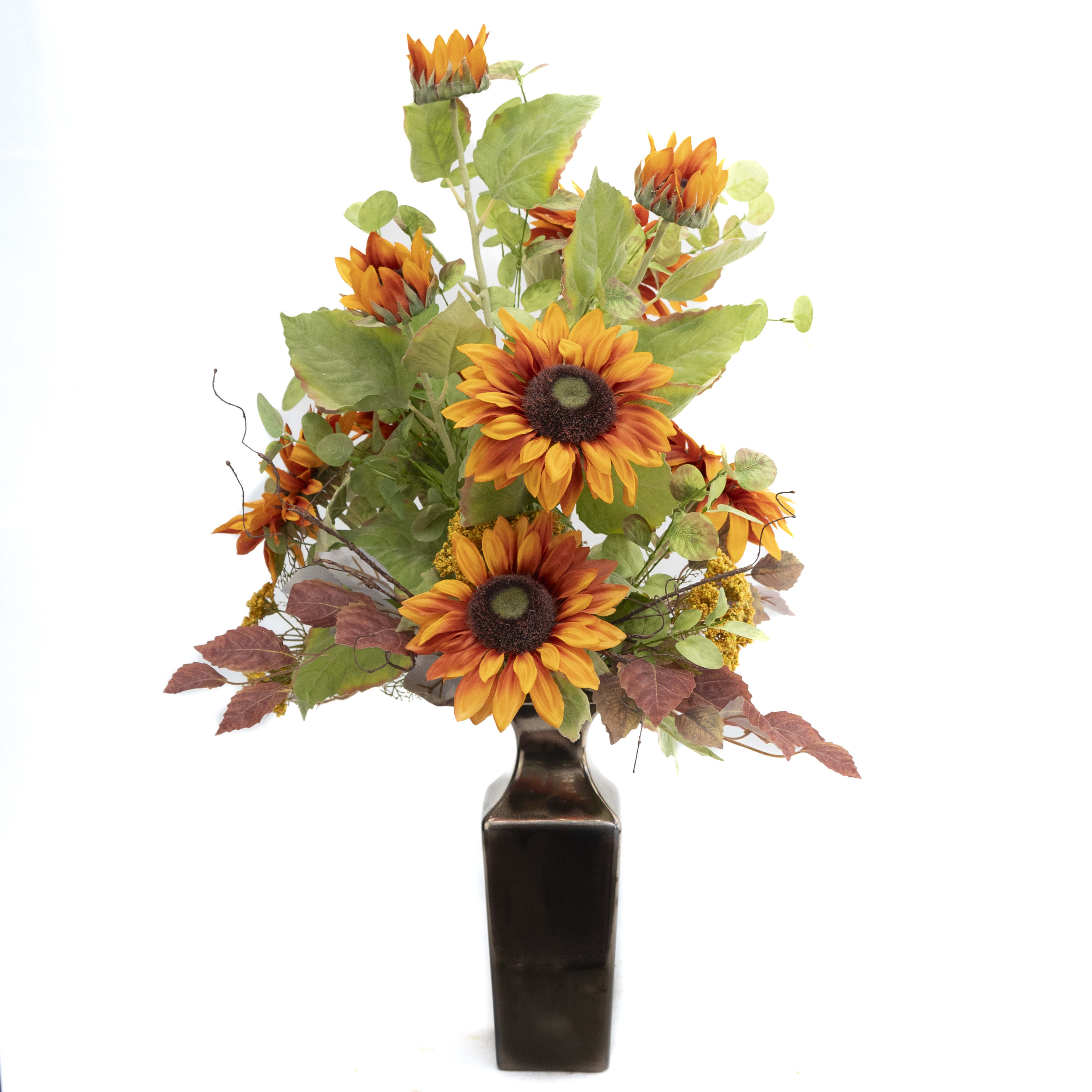 Artificial Sunflower Arrangement Artificial Sunflower Arrangement - This show stopping artificial arrangement stands 31"x 21" and comes in a metallic ceramic container. gorgeous Sunflower are 6 1/2" across and are complimented by golden yellow Yarrow and Eucalyptus. This arrangement is all around which makes it very versatile in where it can be placed in a home or office.