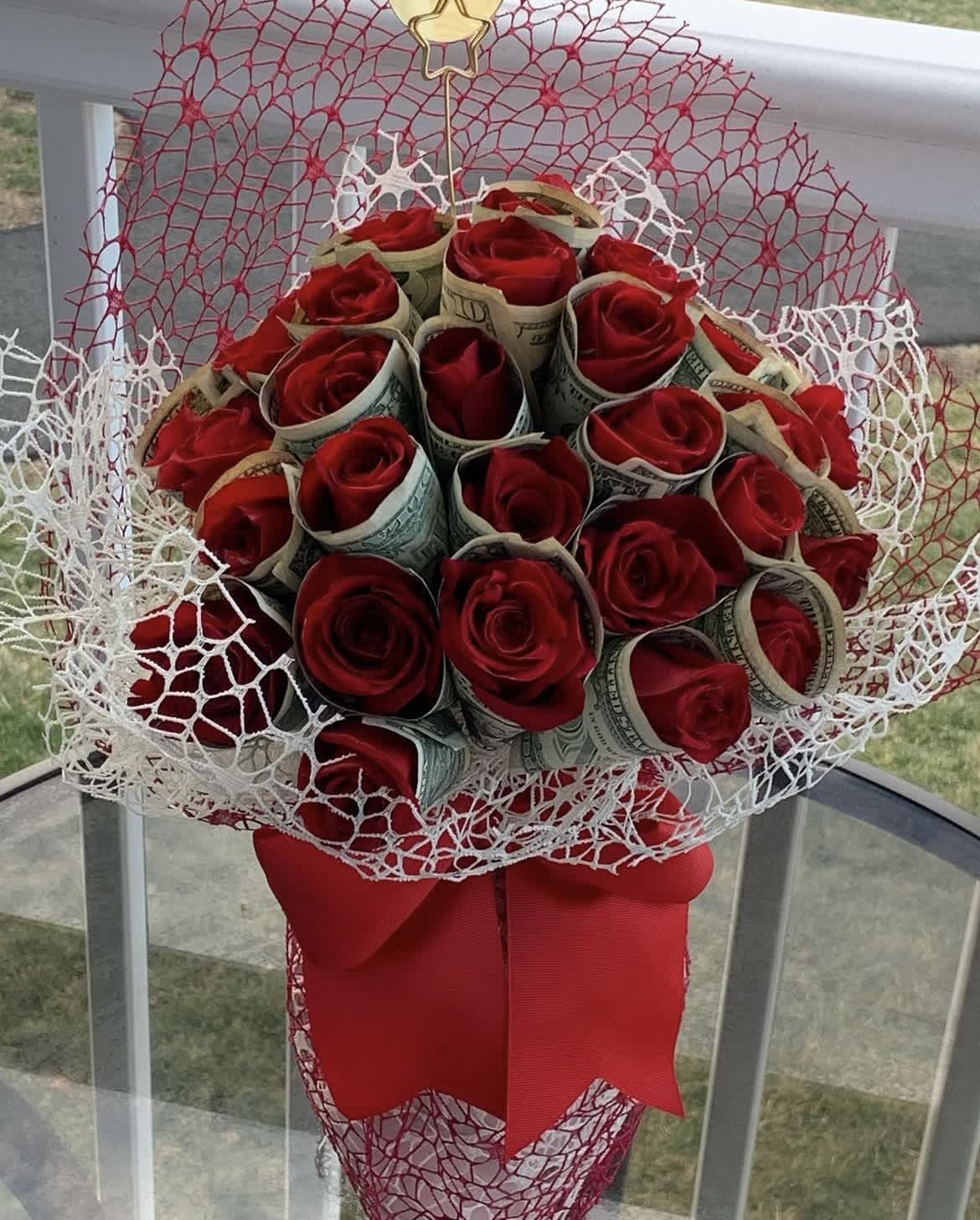 Red roses wrapped in 20 bills in a clear vase by lav.ishbouquets - Send a cute and sweet red rose money vase to your love, your friend, or your relative for Valentine's day. Sending this arrangement is a lovely gesture and shows that you are thinking of them without breaking the bank