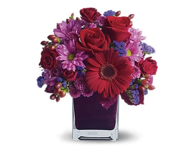 It's My Party By Teleflora - The only crying that this plum party arrangement might inspire are tears of joy! So fabulous. So fun. So fall with its jewel-toned modern cube that's chock full of gorgeous red, purple and perfect flowers. Red roses and gerberas, dark red spray roses, lavender chrysanthemums, purple statice and red hypericum are beautifully arranged in a plum cube vase. So get the party started!   Orientation : All-Around  All prices in USD ($)  Standard  T173-1A  Deluxe  T173-1B  Premium  T173-1C