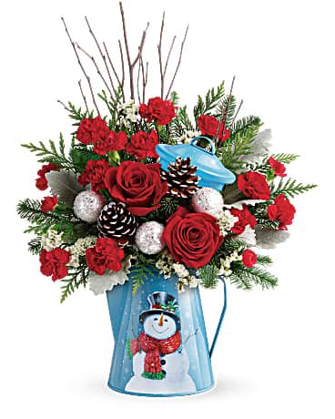Teleflora's Snowy Daydreams Bouquet - Pour on the Christmas charm with this radiant red bouquet, beautifully arranged in a vintage-inspired metal kettle with smiling snowman design. This bouquet includes red roses, red miniature carnations, white sinuata statice, birch, noble fir, flat cedar, and dusty miller. Delivered in a Snowy Daydreams kettle.   Orientation : One-Sided  All prices in USD ($)  Standard  T18X300A  Deluxe  T18X300B  Premium  T18X300C