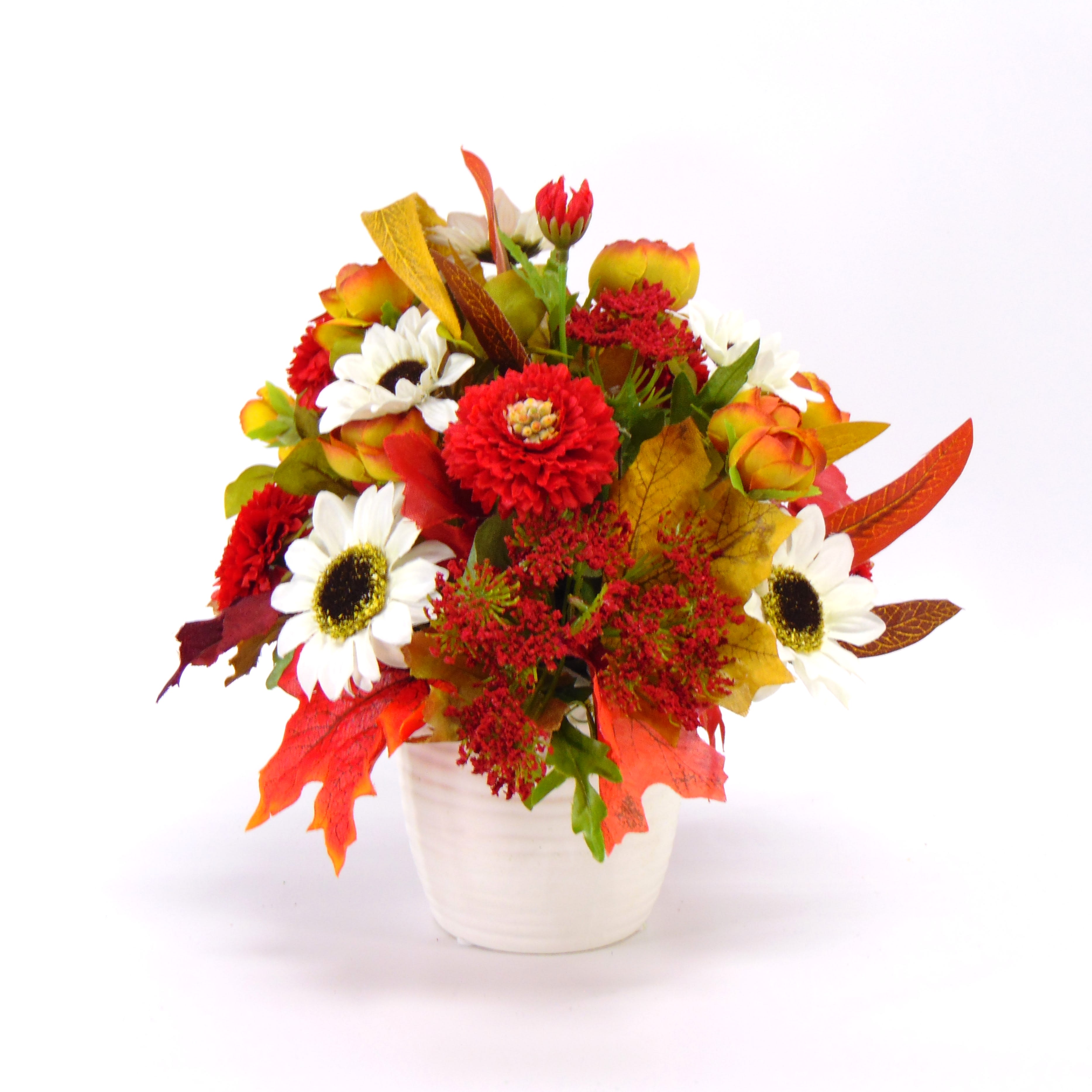 Autumn Reds Silk Design - All-around silk arrangement with shades of red, fall leaves. white sunflowers and accents in a white ceramic pot.