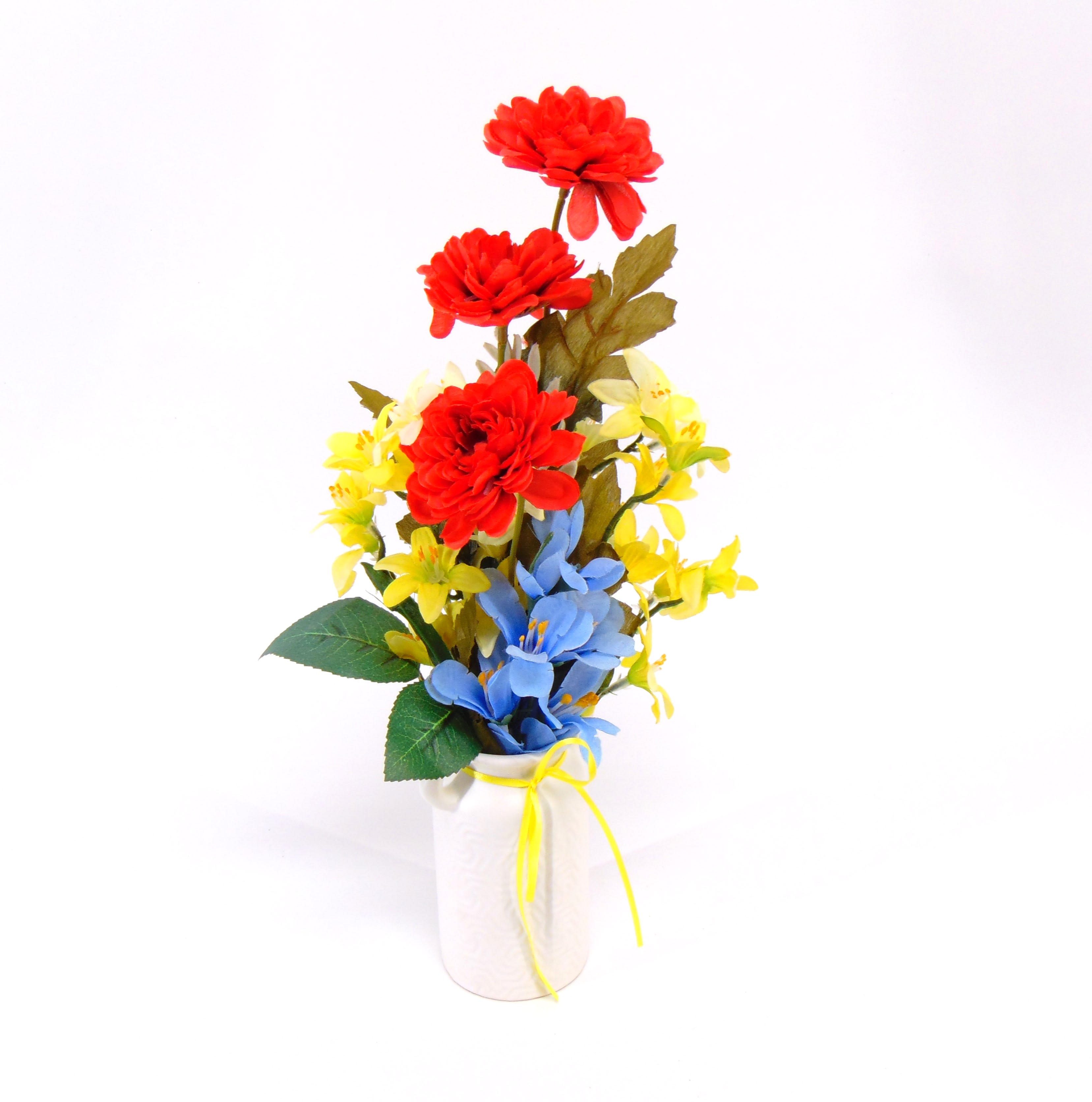 RYB Mini Silk in Ceramic Milkcan - Red, Yellow and Blue silk flowers in a minature milkcan.