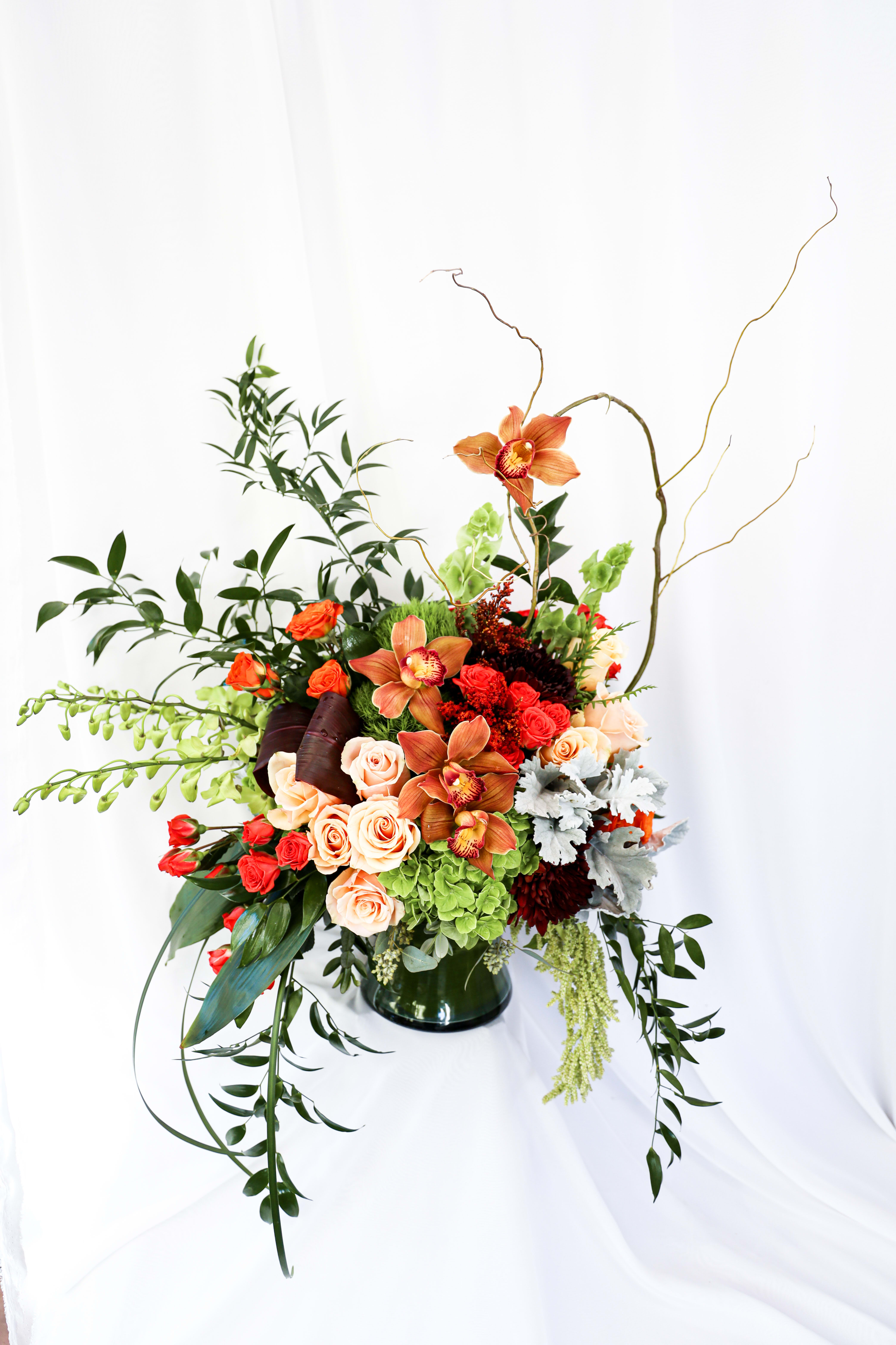 The Floating Orchid- order in advance - This arrangement will simply put you in AWE! The arrangement is 24 inches x 20 inches.   ODER IN ADVANCE- Please email or call shop at least 3 days prior to placing your order to ensure all flowers are in stock. 