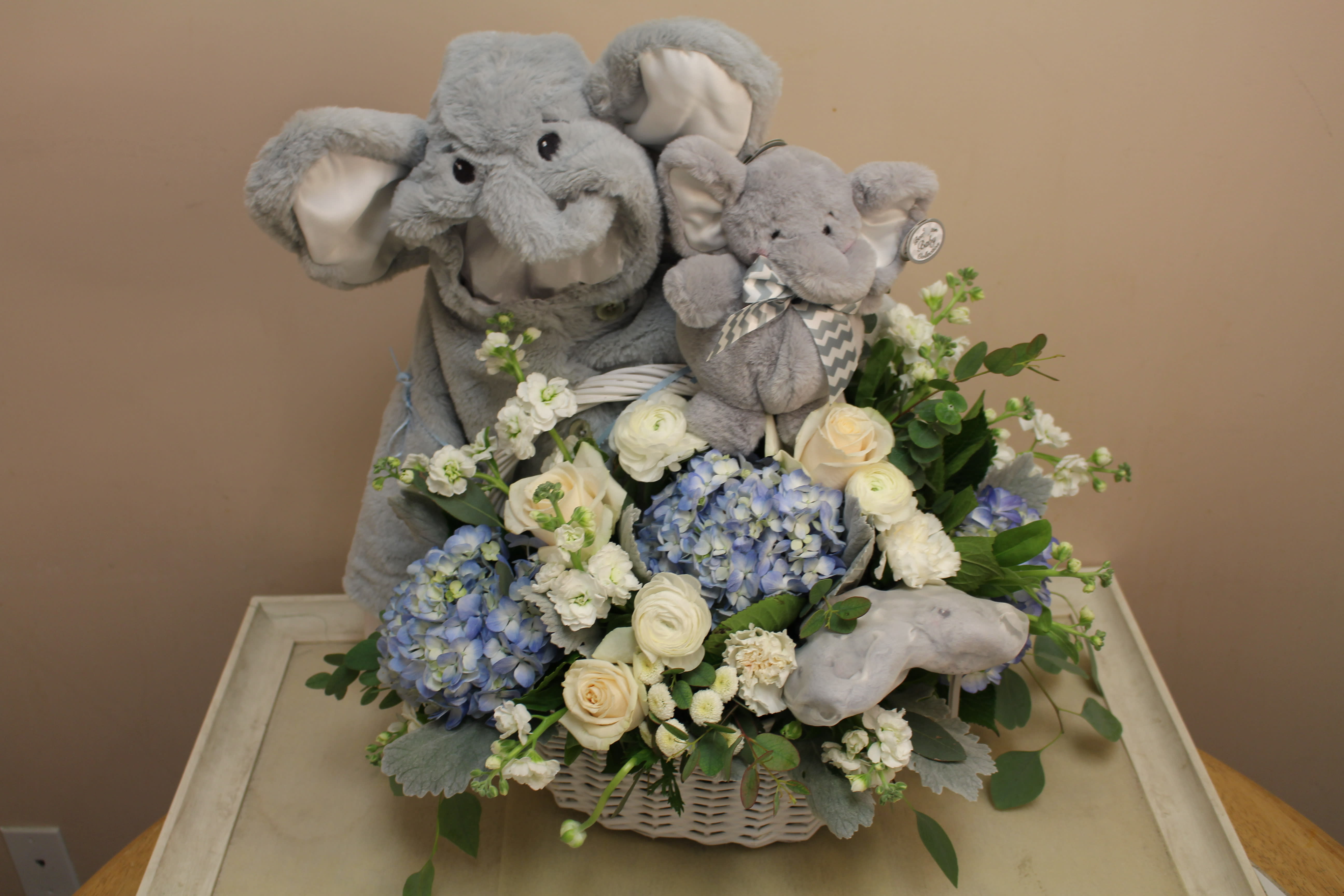 Lil’ Spout Gray Elephant  - What A wow factor!  A baby boy elephant, jacket, plush animal and booties  filled with a flower arrangement