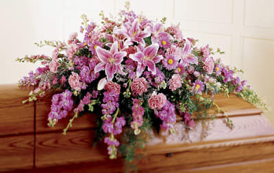 Peaceful Passage Casket Spray - Stargazer lilies are combined with daisies, stock, carnations and more to create this elegant casket display. (To be displayed on a casket).