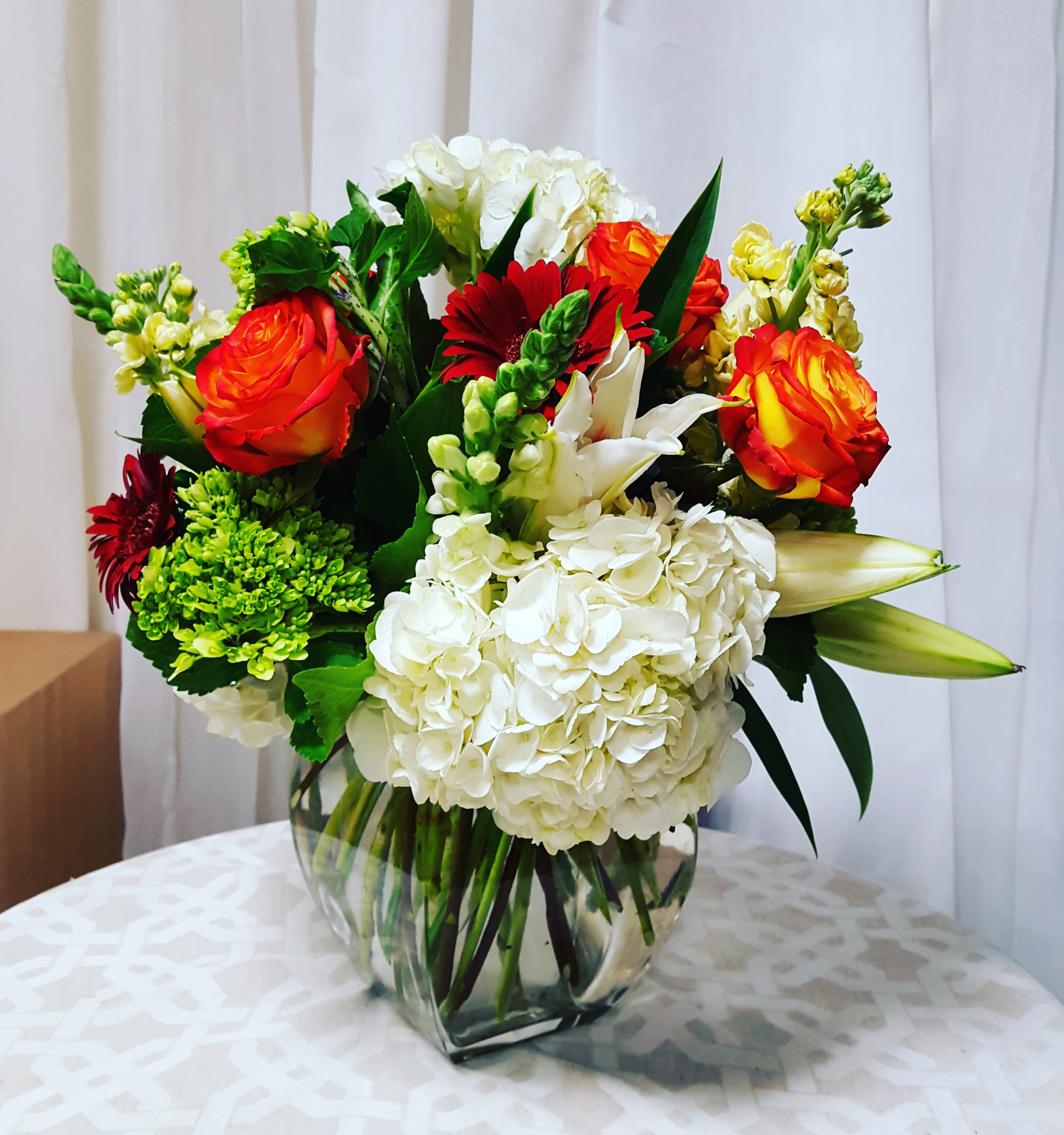 Timeless Elegance  - Gerberas, roses, hydrangeas, stargazers and snaps. 