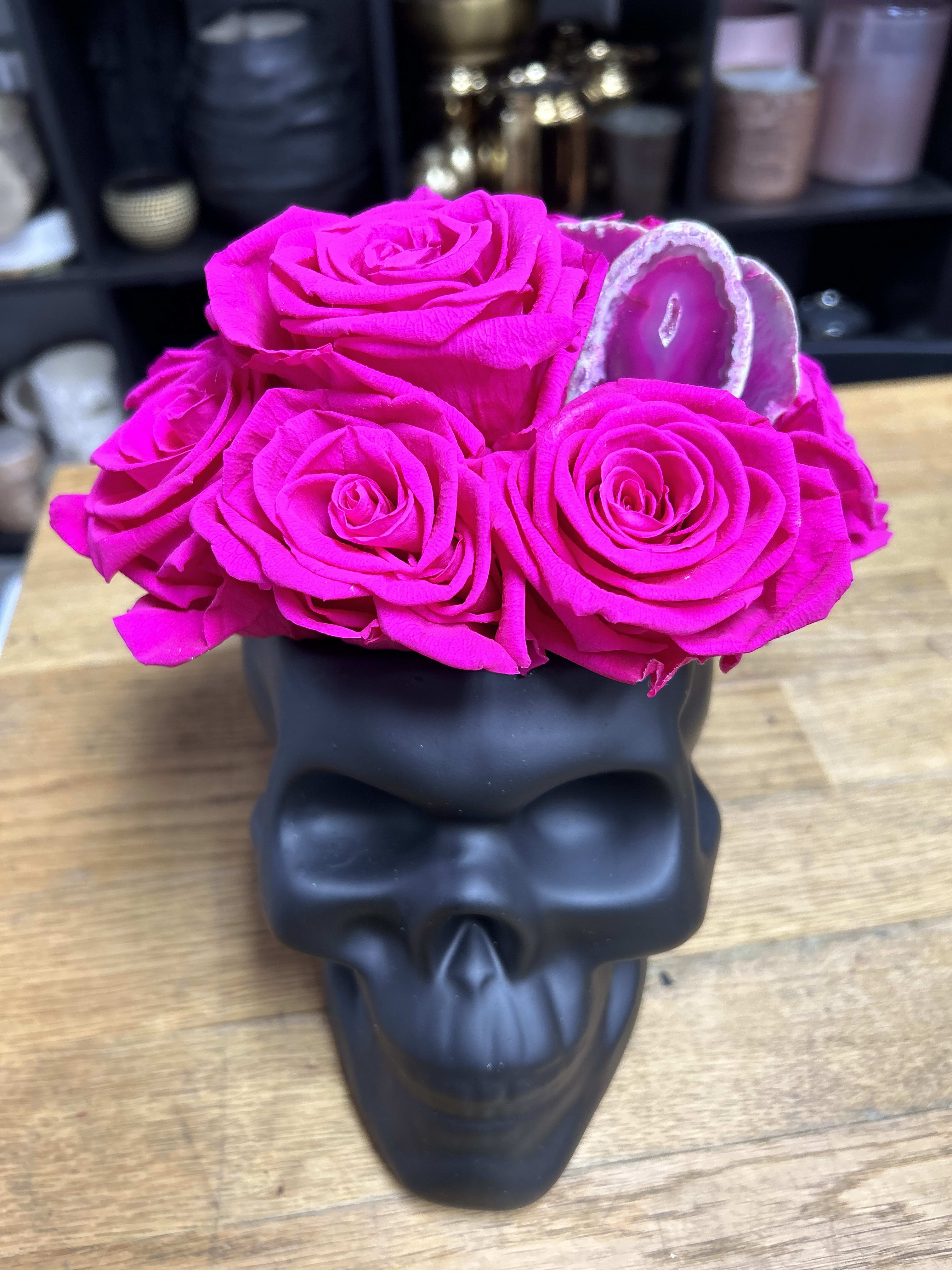 Preserved Roses in Skull Vase - Hot Pink Roses and a geode in skull vase. 8” long by 7.5” 
