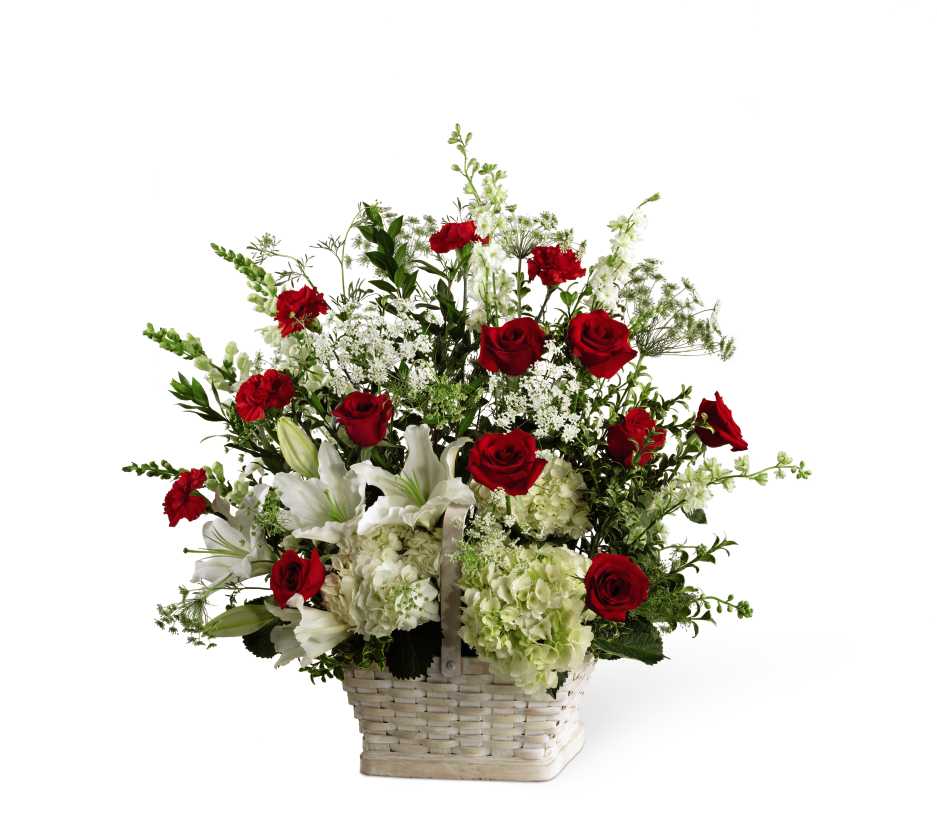 The FTD In Loving Memory Arrangement - The FTD In Loving Memory Arrangement pays tribute to a life well-lived with every beautiful bloom. Red roses and carnations pop amongst this incredible arrangement of white hydrangea, Oriental lilies, snapdragons, larkspur, Queen Anne's Lace and assorted lush greens, lovingly arranged in a large whitewash rectangular basket to create an impressive display of caring kindness.