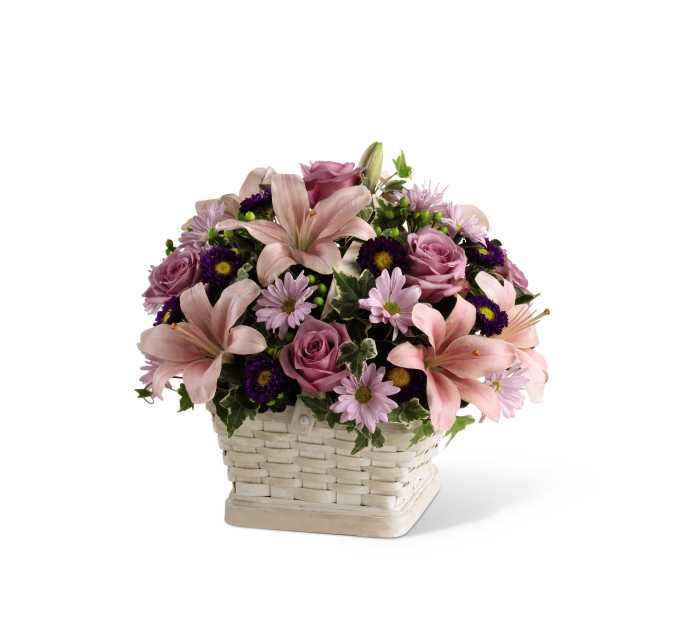 The FTD Loving Sympathy Basket - The FTD Loving Sympathy Basket is a wonderful way to convey your condolences for their loss. Lavender roses, pink Asiatic lilies, lavender daisies, purple matsumoto asters, green hypericum berries and lush greens are sweetly arranged in a square whitewash basket to create a lovely way to offer you caring kindness during this trying time.