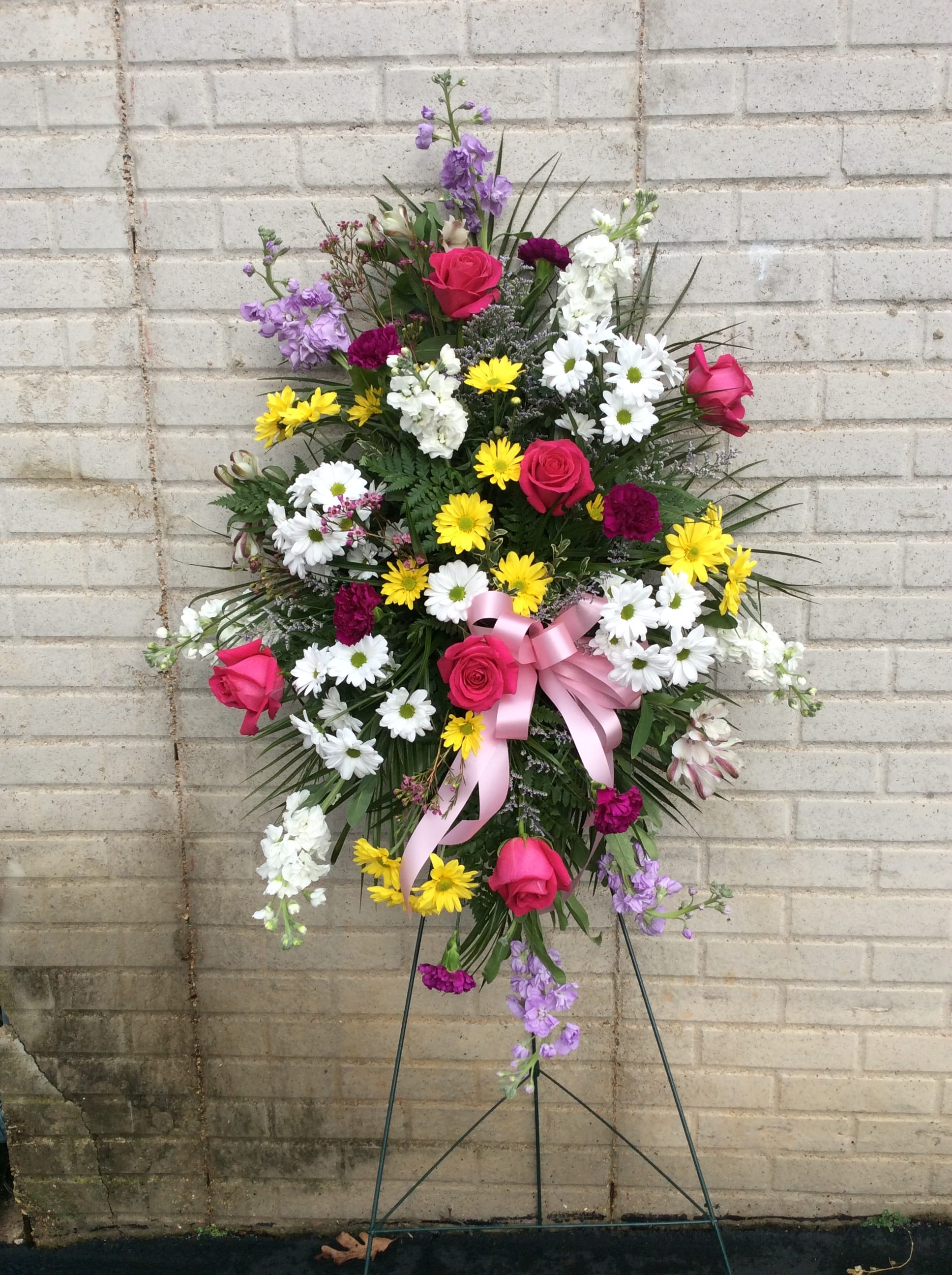 Spring Mix Standing Easel spray - Beautiful mix of spring colored florals in a sympathy standing spray. Florals may vary due to availability but we will keep the overall style, color, and theme.