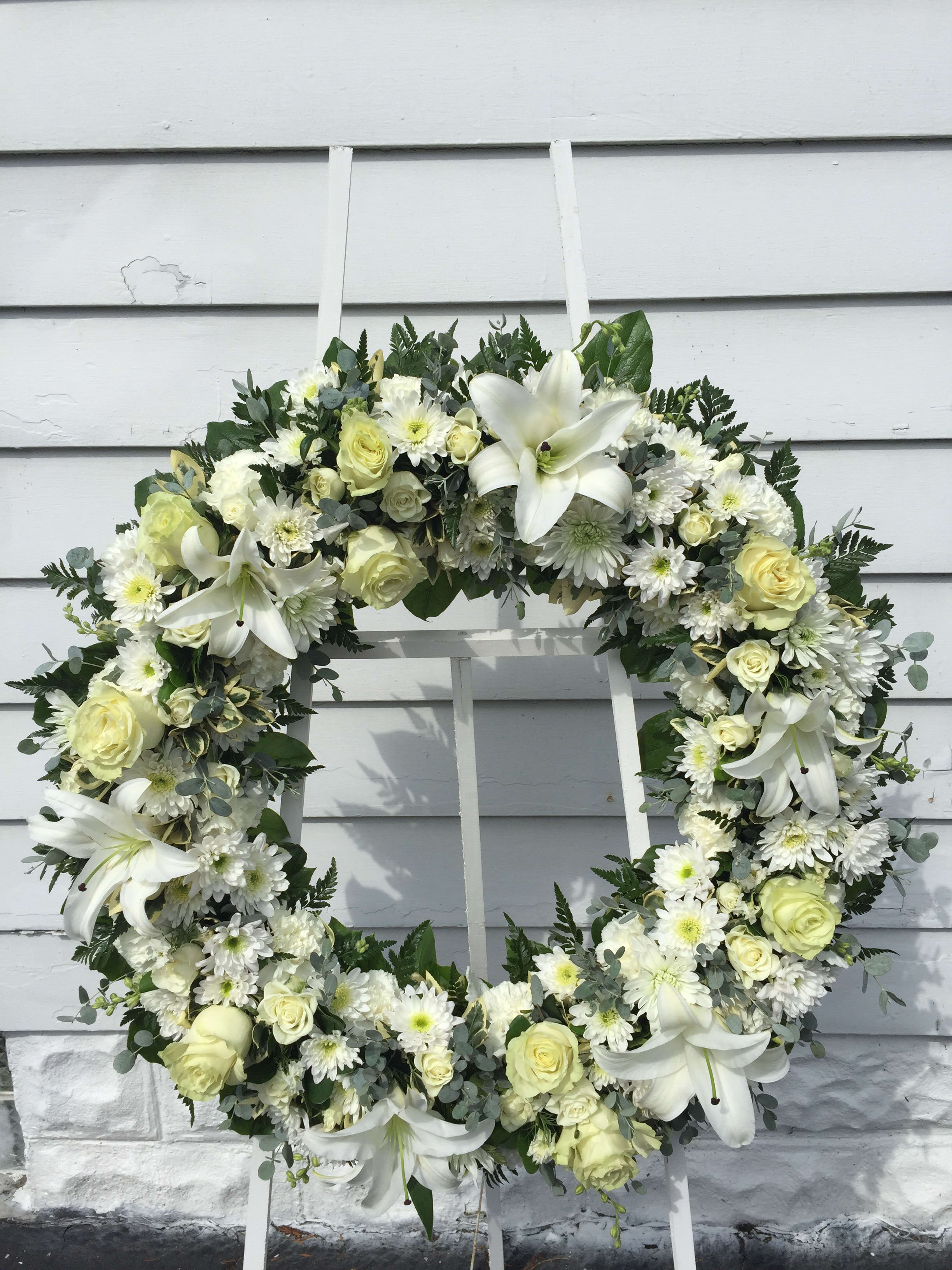 Unity Love - All white 25&quot; wreath white roses, white lilies, white pompons with beautiful mixed seasonal greens