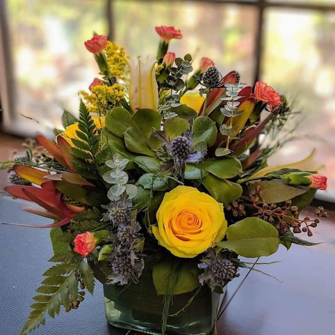 Heather Sugarbaker - A fun twist on the Desert Wildblooms, specially designed to brighten up a friend's day! Yellow and orange- earth hues with a succulent and blue thistle brings that desert style into your home.