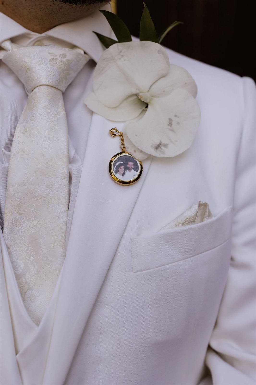 Kelsay's wedding groom's boutonniere  - Beautiful single white phalaenopsis orchid is perfect for exquisite groom's boutonniere. 