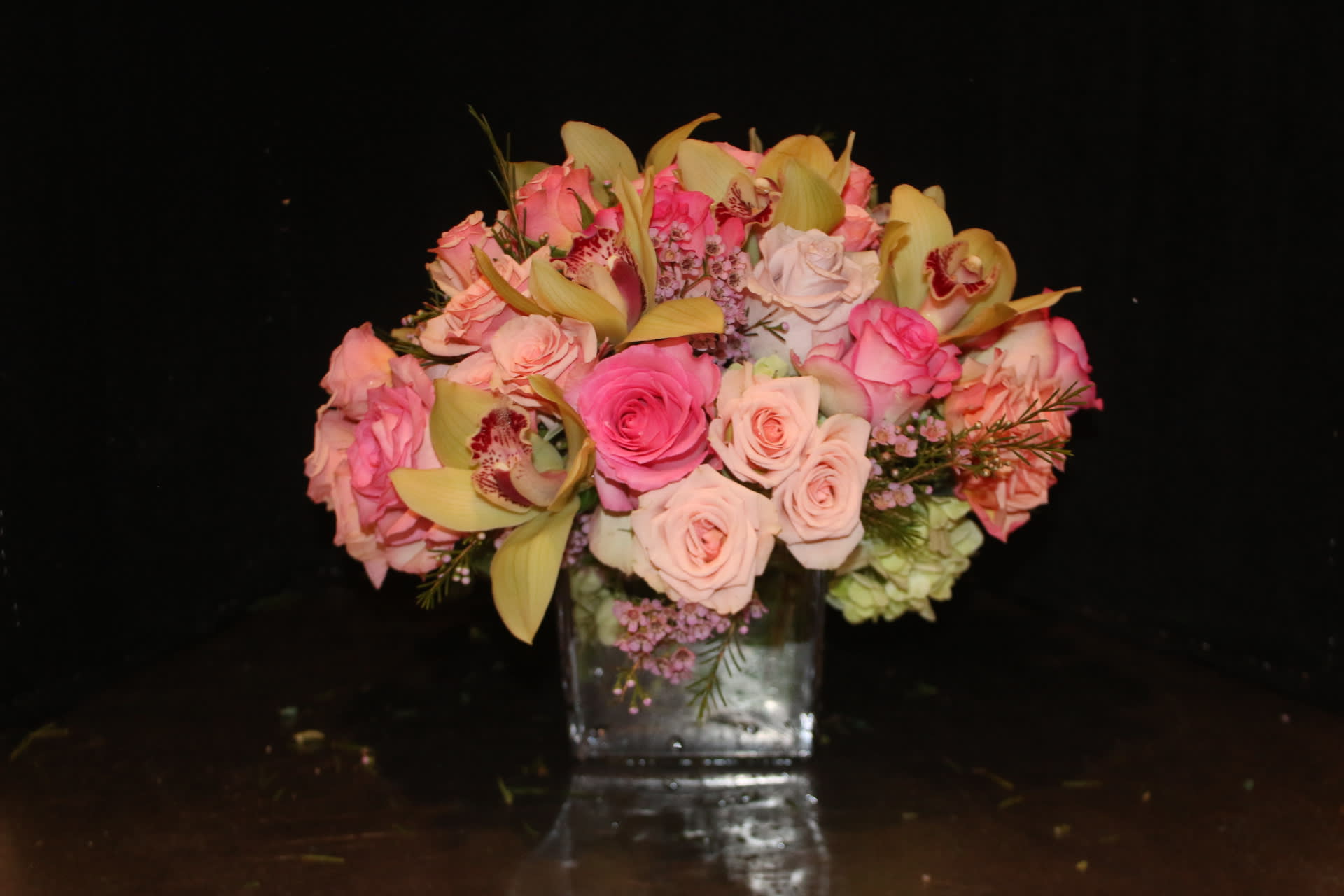 The Blushing Orchid - Orchids accentuated with dark and light pink tones. 