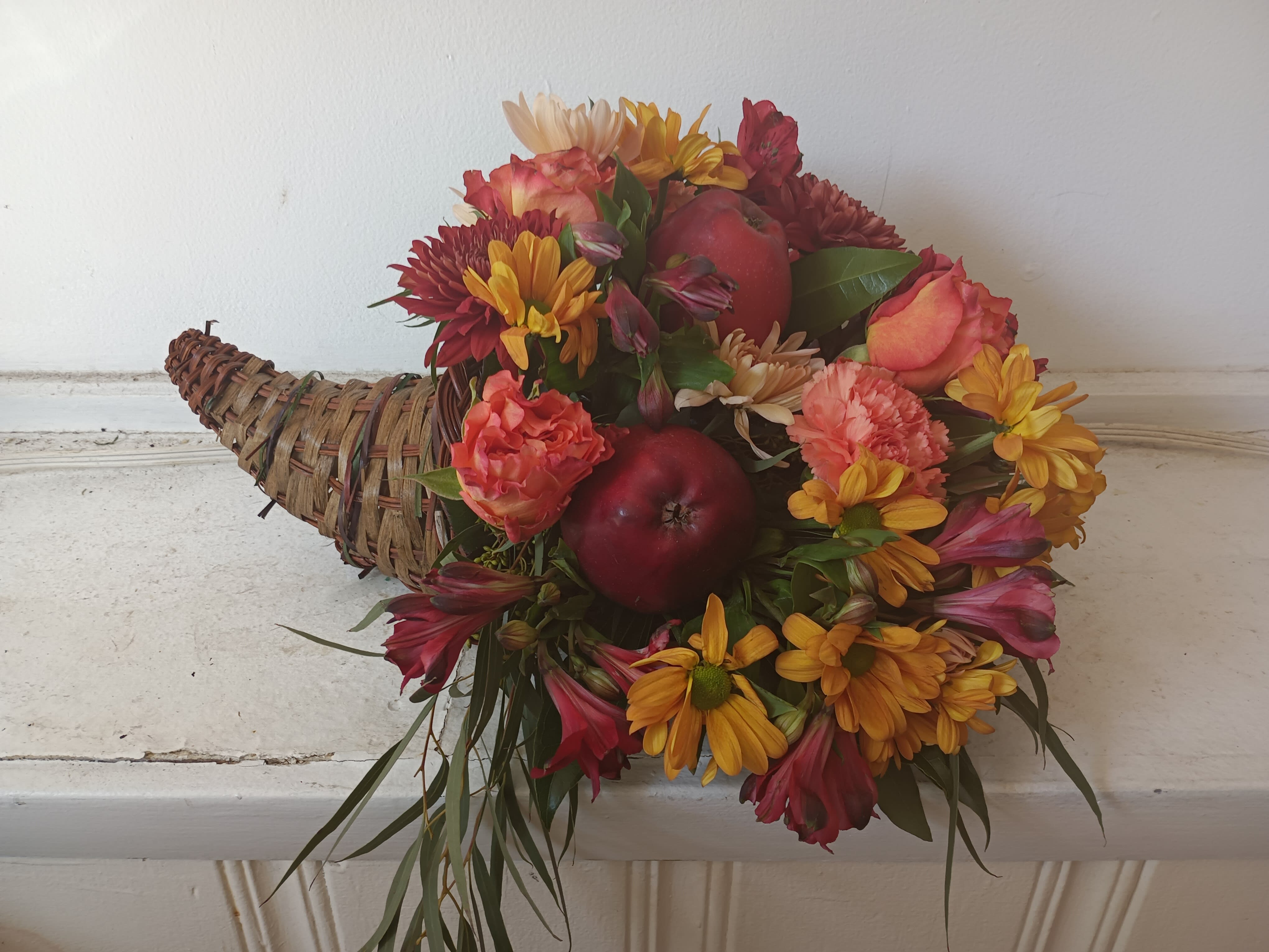 Fall cornucopia  - Beautiful rich fall colors roses, daisies, carnations, apples and greens cornucopia centerpiece 