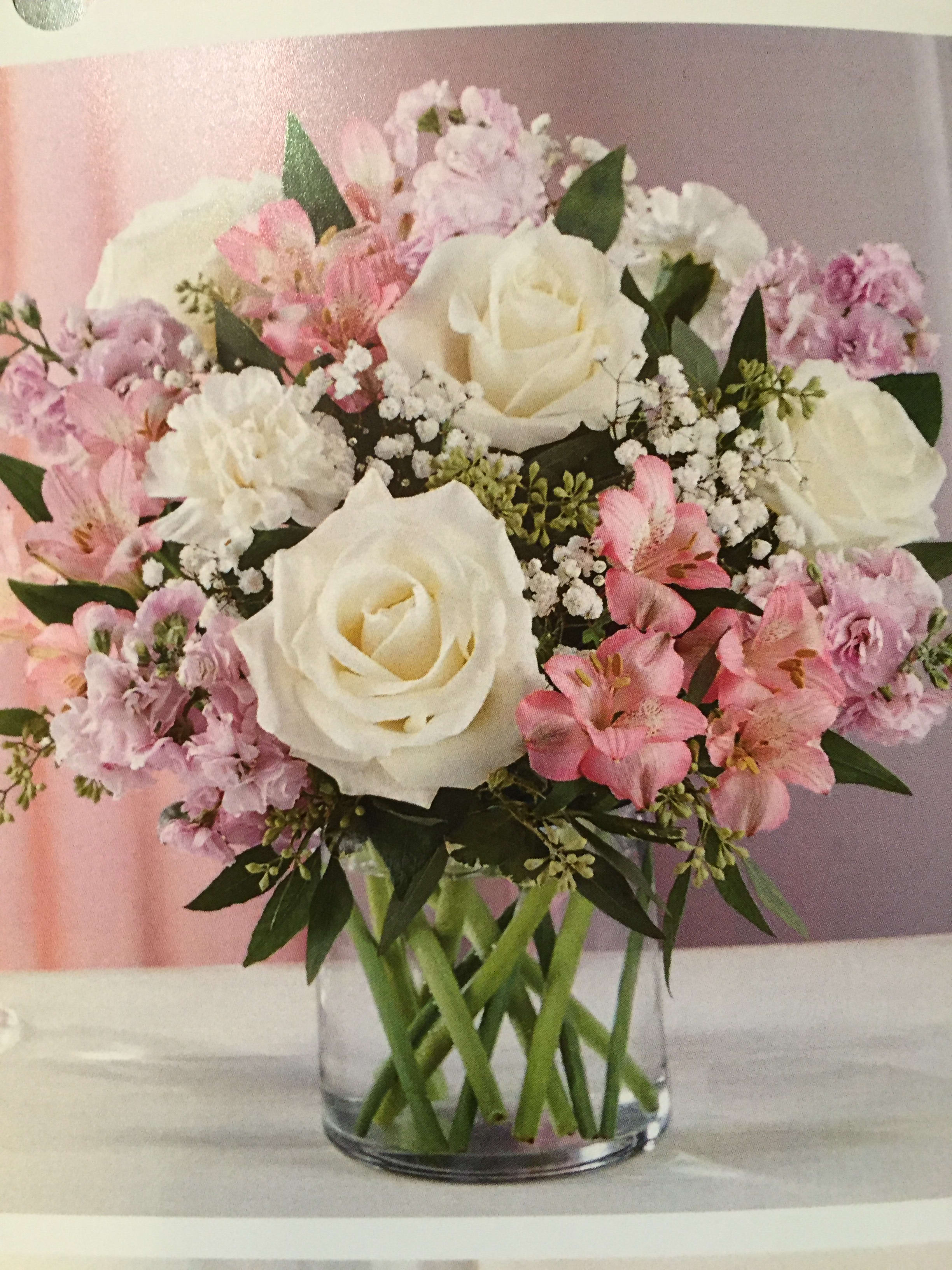 Simply Sweet Simply Sweet - White roses, mini carnations, pink alstroemeria, baby's breath with greens in clear vase