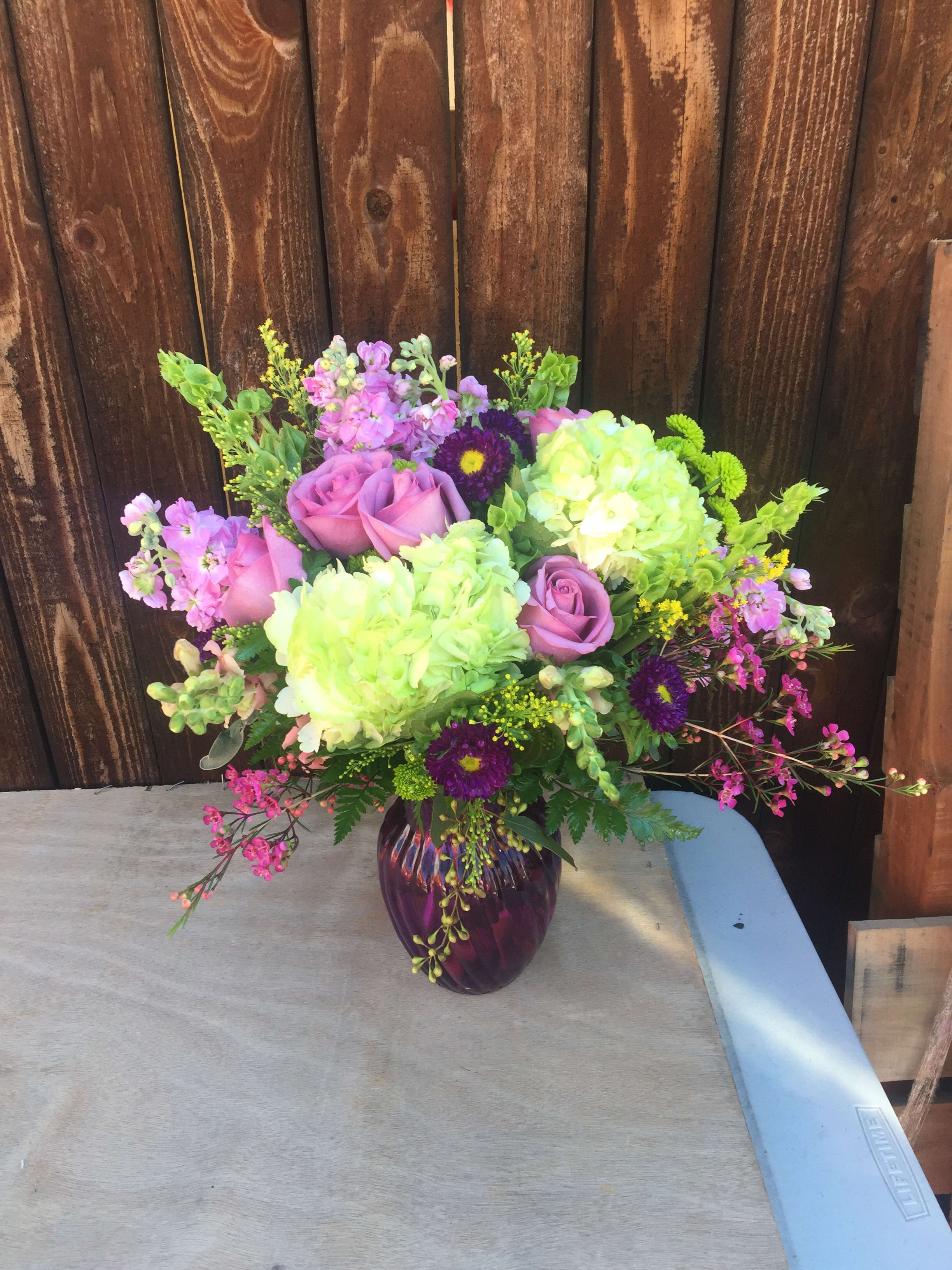HAVE A LOVELY LAVENDER DAY BOUQUET. - AN OVERFLOWING VASE OF NATURES FINEST BLOOMS, CLUSTERED ARTISTICALLY TOGETHER TO CREATE A WONDERFUL REFRESHING EXPRESSION OF FLORAL ART, FEATURING HYDRANGEA AND LAVENDER IMPORTED ROSES.