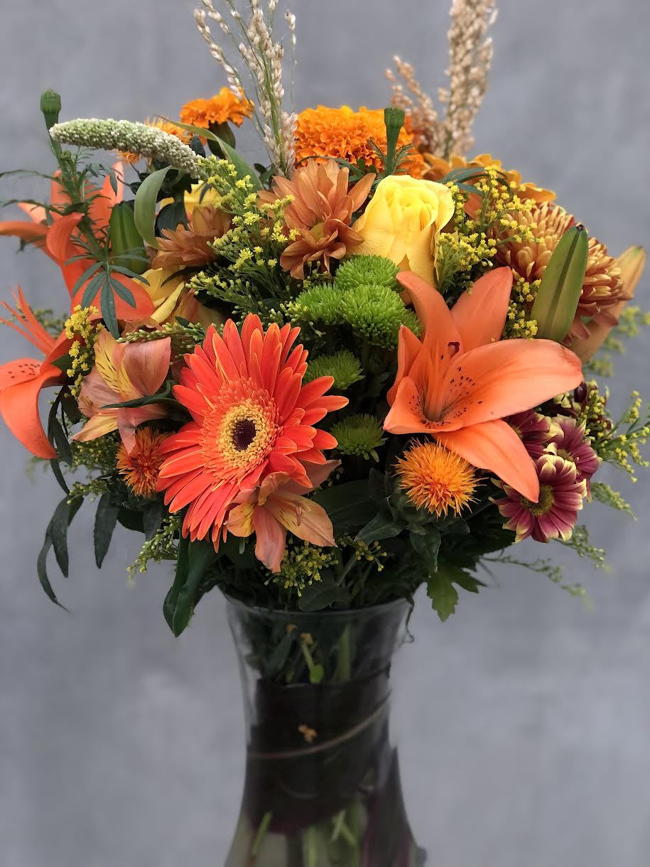 Best Season Best Season - Include Tiger lilies, Roses, Alstroemerias, etc arranged in a glass vase.
