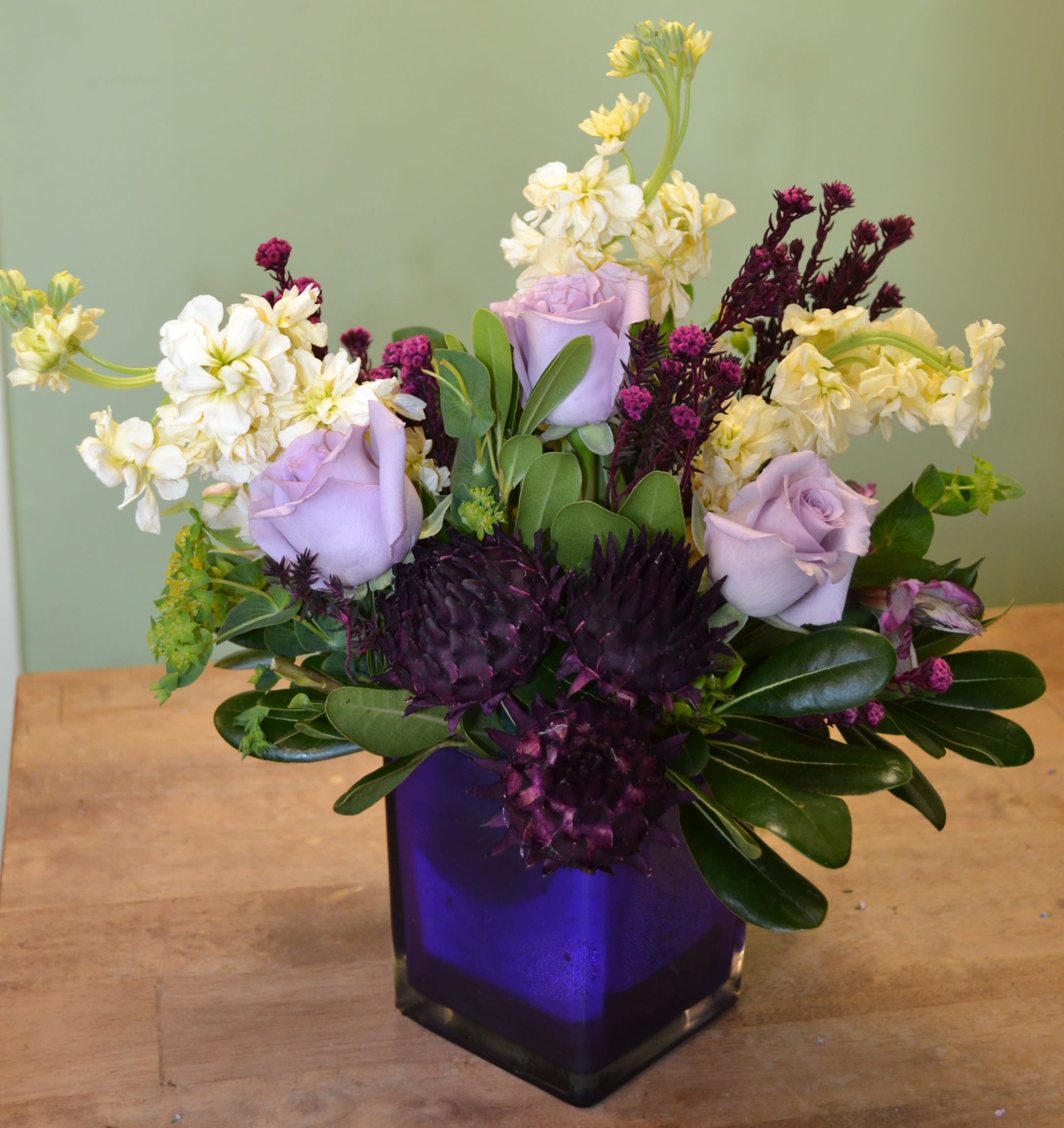 Ocean Breeze - Part of our exclusive 'Alive and Dried' collection, this arrangement exhibits a combination of live, fresh cut flowers as well as dried to create a unique one of-a-kind artistic design. 