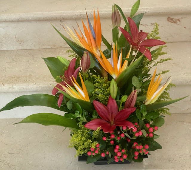 See You at the Bar Premium - Tropical flowers as shown arraged in a vase  