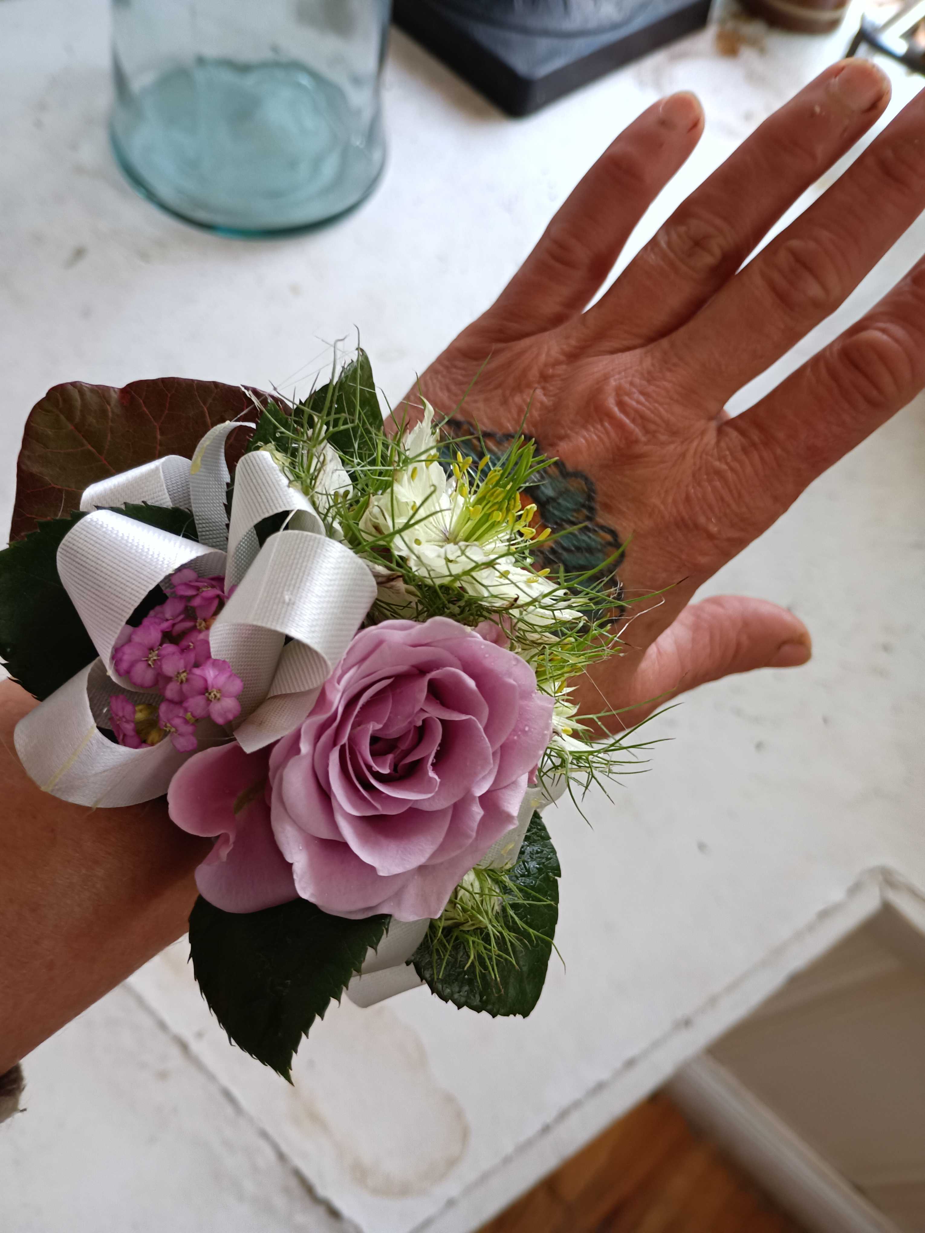 Rachel's wedding corsage - Sweet purple and white combination of spray roses, white alstroemeria and greens wrist corsage
