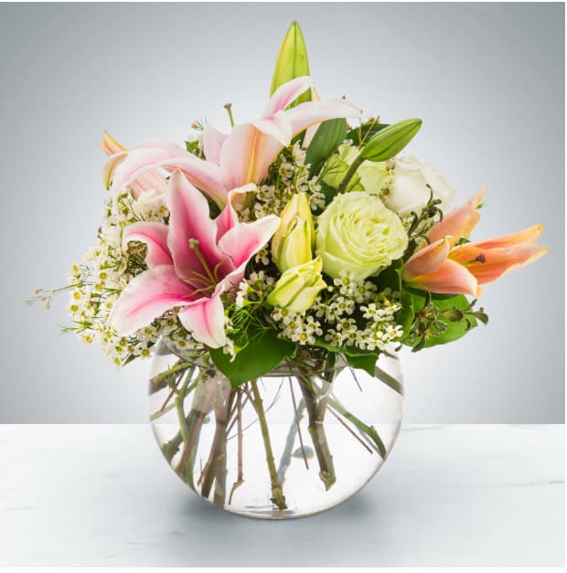 Polished Pearl by BloomNation™ Polished Pearl by BloomNation™ - A beautiful bubble arrangement, featuring pink lilies, white and green roses, and more, this arrangement is the perfect all-occasion gift. Pearls are the birthstone of June making this a great option for an early summer birthday! Approximate Dimensions: 10''D x 13''H