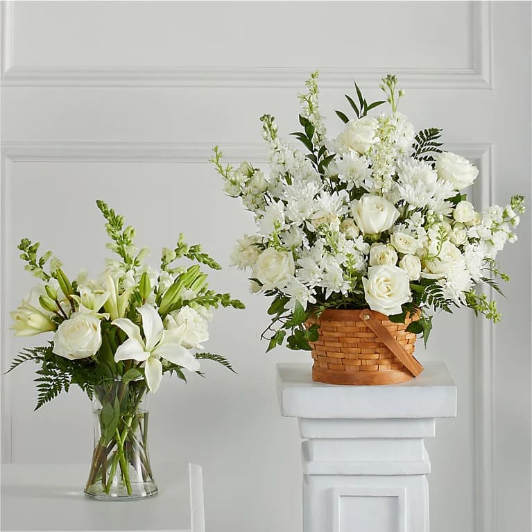 Sincerest Condolences  - As part of our Touching Tribute Collection, this set, resplendent in classic whites, features traditional arrangements meant for celebrating the life of a loved one at a visitation, funeral, church service, cremation, or cemetery service – or as a delivery to the home of the family.  Please Note: The bouquet pictured reflects our original design for this product. While we always try to follow the color palette, we may replace stems to deliver the freshest bouquet possible, and we may sometimes need to use a different vase or basket.