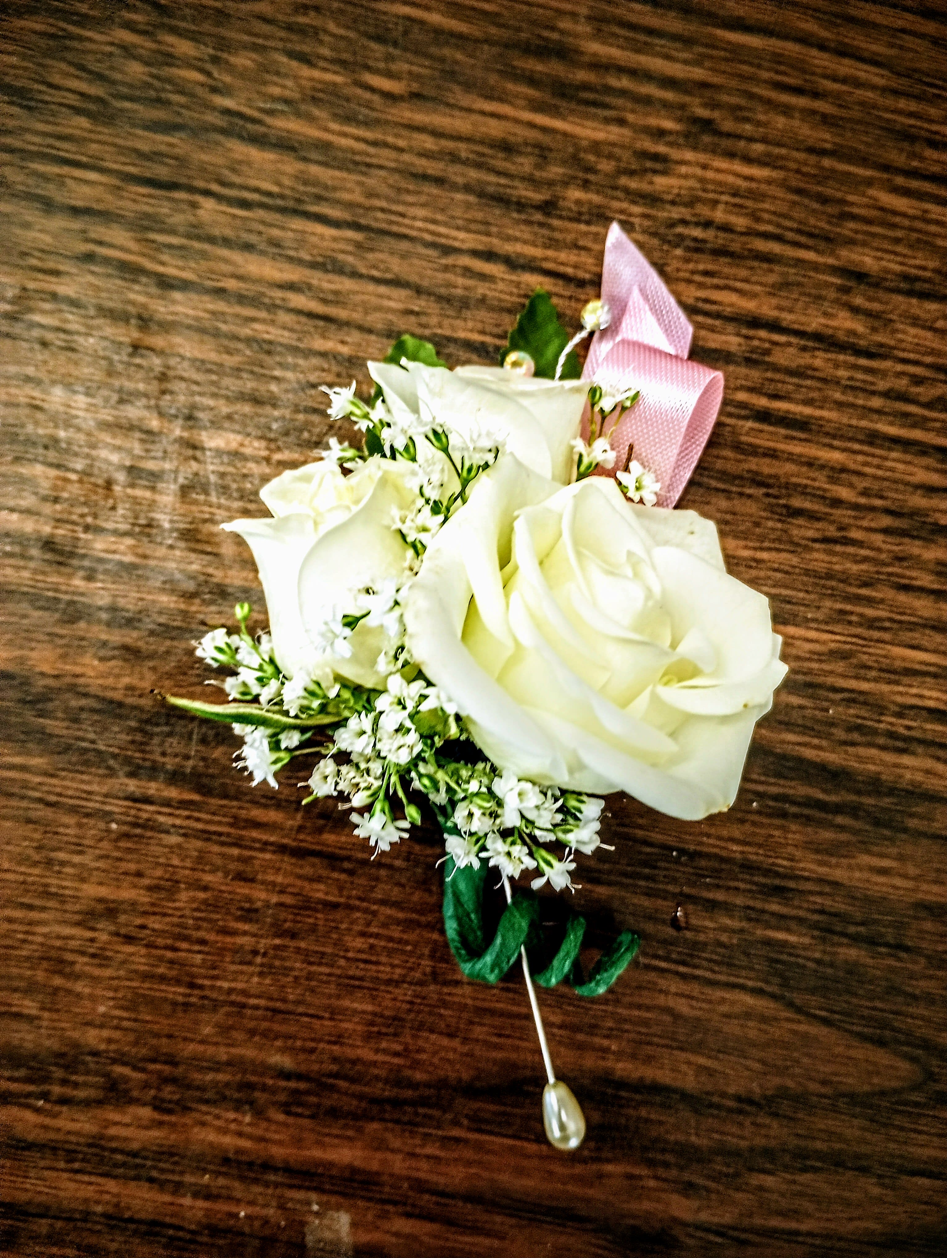 Boutonniere Boutonniere - Spray roses in white, pink, red, yellow or lavender, ribbon to coordinate and filler flowers. Packaged for gift giving.