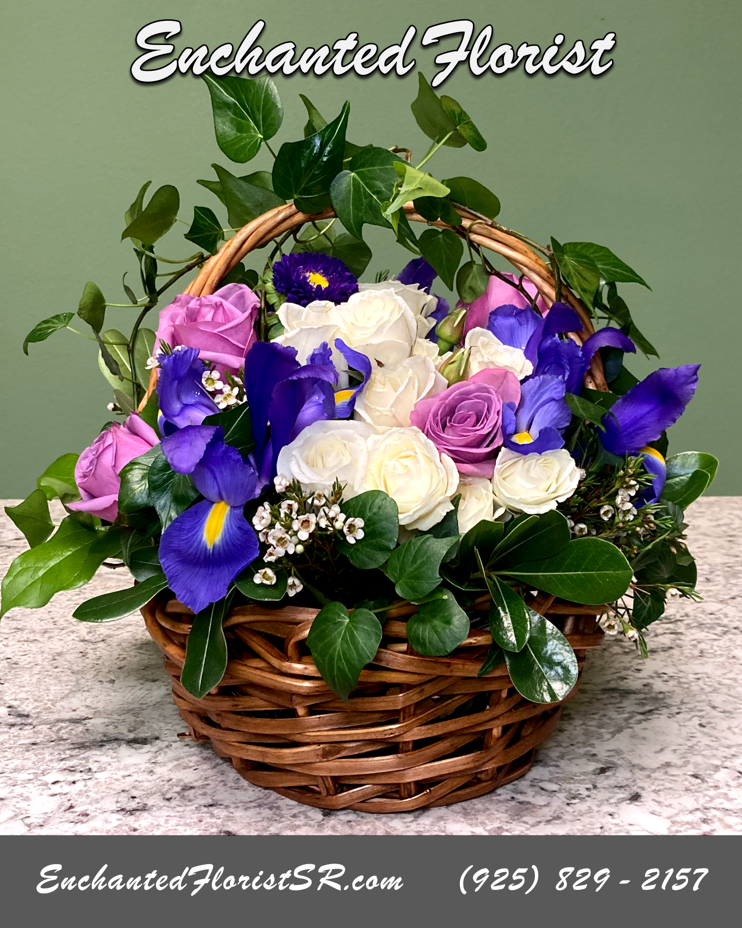 Twilight - Flower Basket - Twilight is a beautiful mixed Flower Basket that features blue Iris, lavender Roses, white Spray Roses and purple Asters, accented with white Wax Flower, green Ivy and freshly cut Pittosporum leaf.  Arrangements Included: 1  Arrives In: Natural round wicker basket w/ handle  Orientation: Any-Sided  Approximate Dimensions: 14&quot; Tall 16&quot; Wide 10&quot; Basket Diameter