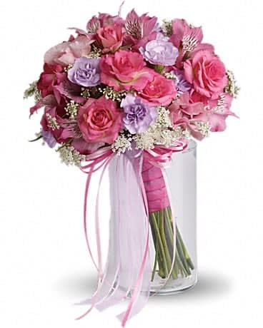 Fairy Rose Bouquet - This petite pink and lavender bouquet was made by magical fairies especially for her special day! Pink alstroemeria, Queen Anne's lace, lavender carnations, pink spray roses and lisianthus, all brought together with taffeta, satin and organza ribbons.
