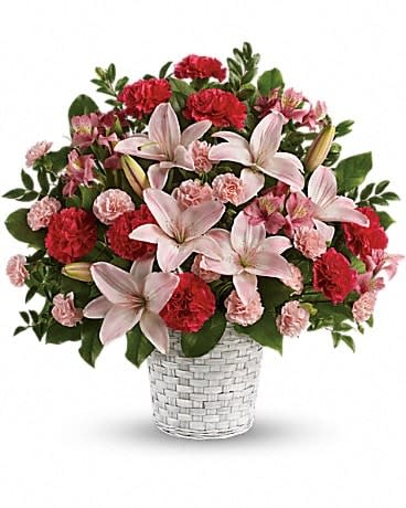 Sweet Sincerity - Convey your sympathy tastefully with this lovely gift of pink floral favorites in a snowy white basket. The family will be deeply touched by your thoughtfulness. The stunning bouquet includes pink asiatic lilies, pink alstroemeria, hot pink carnations and pink miniature carnations accented with assorted greenery. Delivered in a white pot basket.