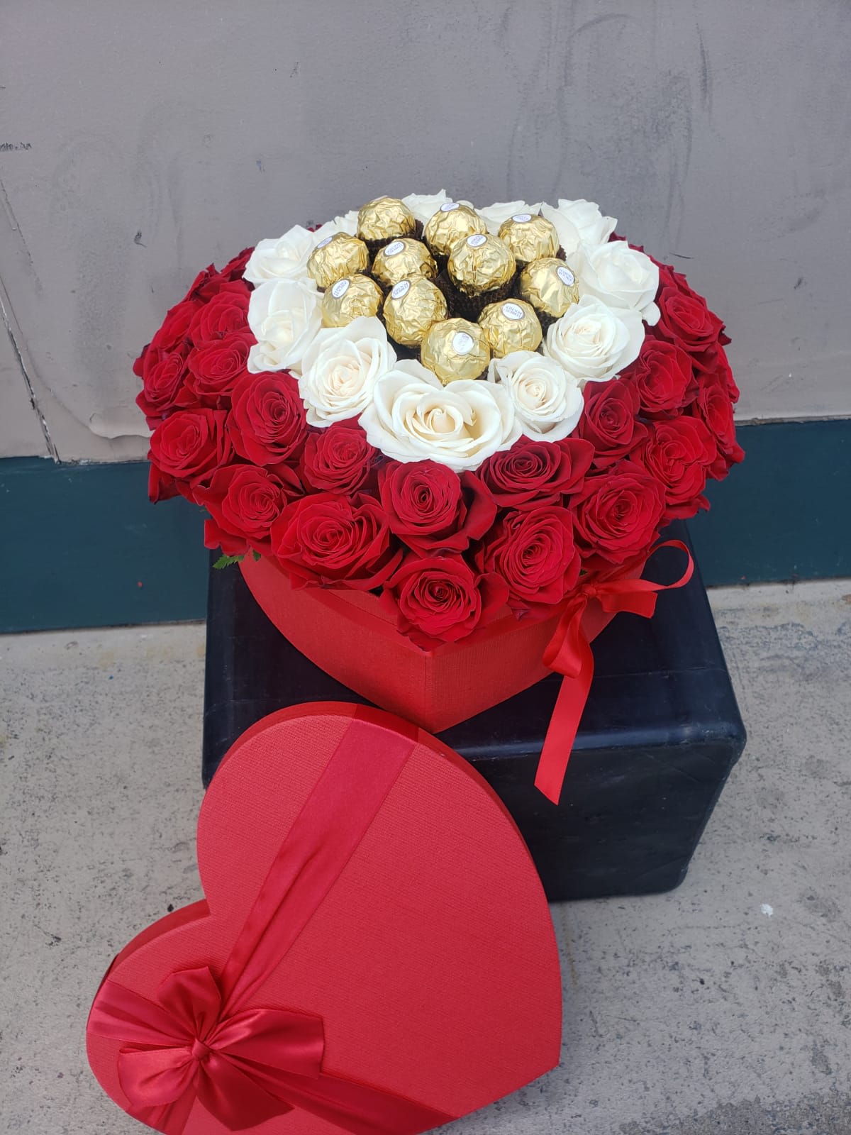 Eternal Heart - 45 Red Roses ,14 White Roses, 11 Pieces  of  Ferrero's Rocher . This beautiful arrangement comes in a red heart- shape box, with a cover of the same color.