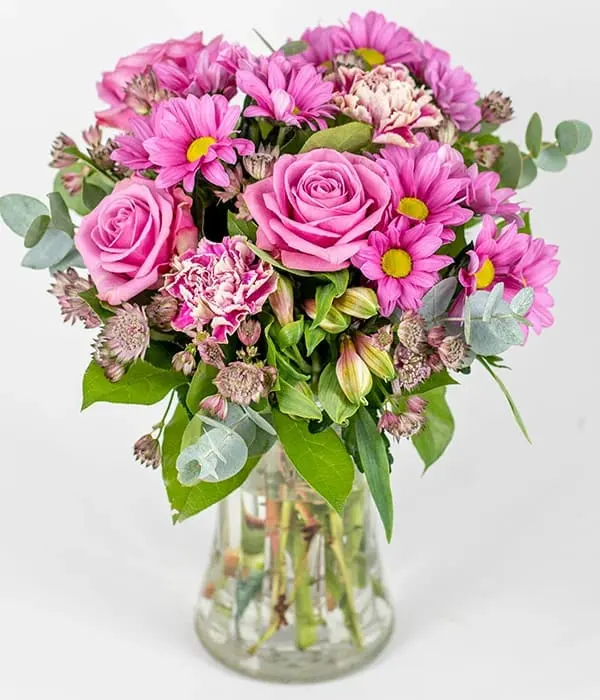 Antique Pink bouquet - A beautiful pink bouquet full of carnations, chrysanthemums and alstroemeria, nestled amongst mixed seasonal foliage