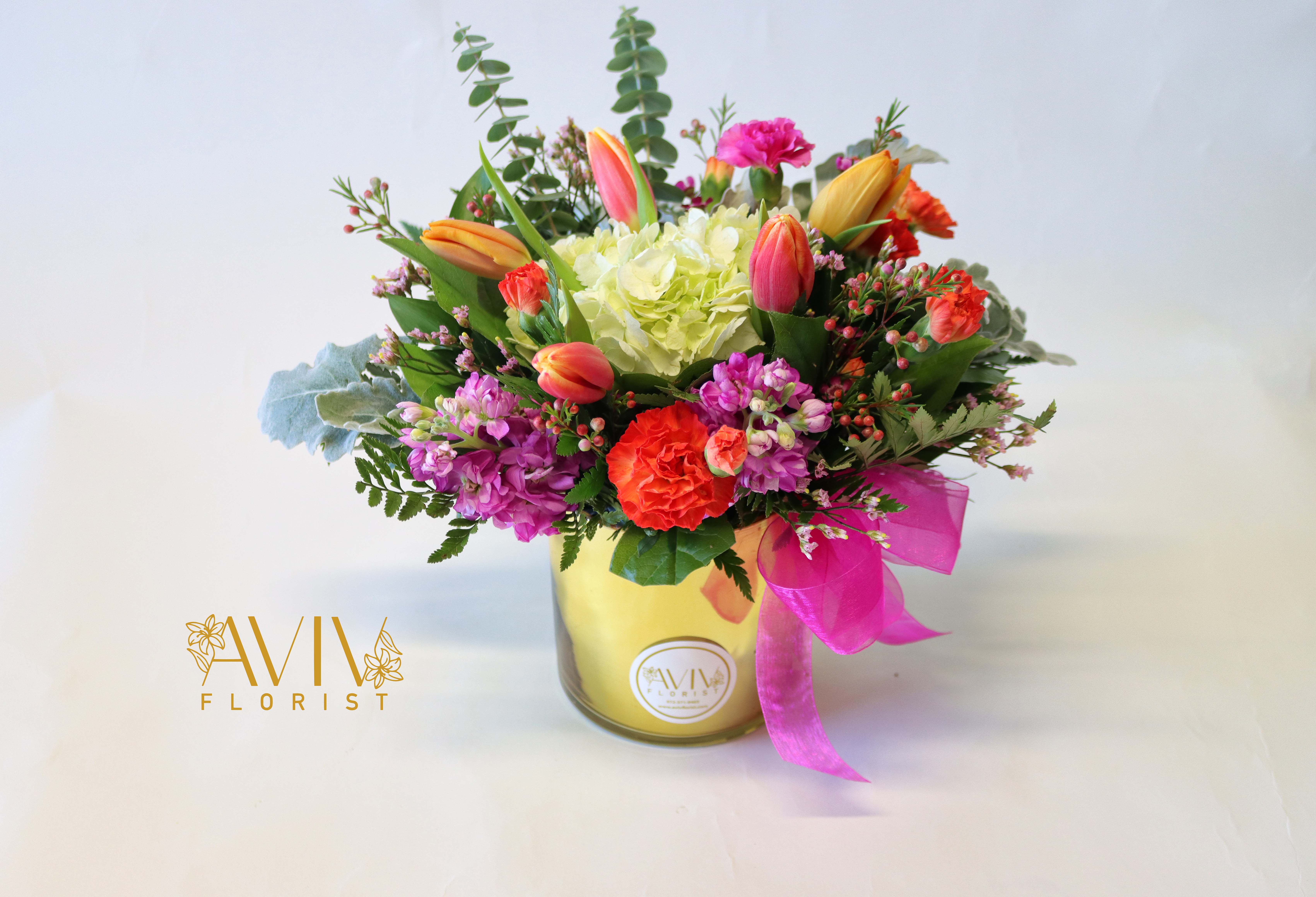 My Charm - This pretty arrangement is classically elegant and delivered in gold or glass vases, ready to impress.