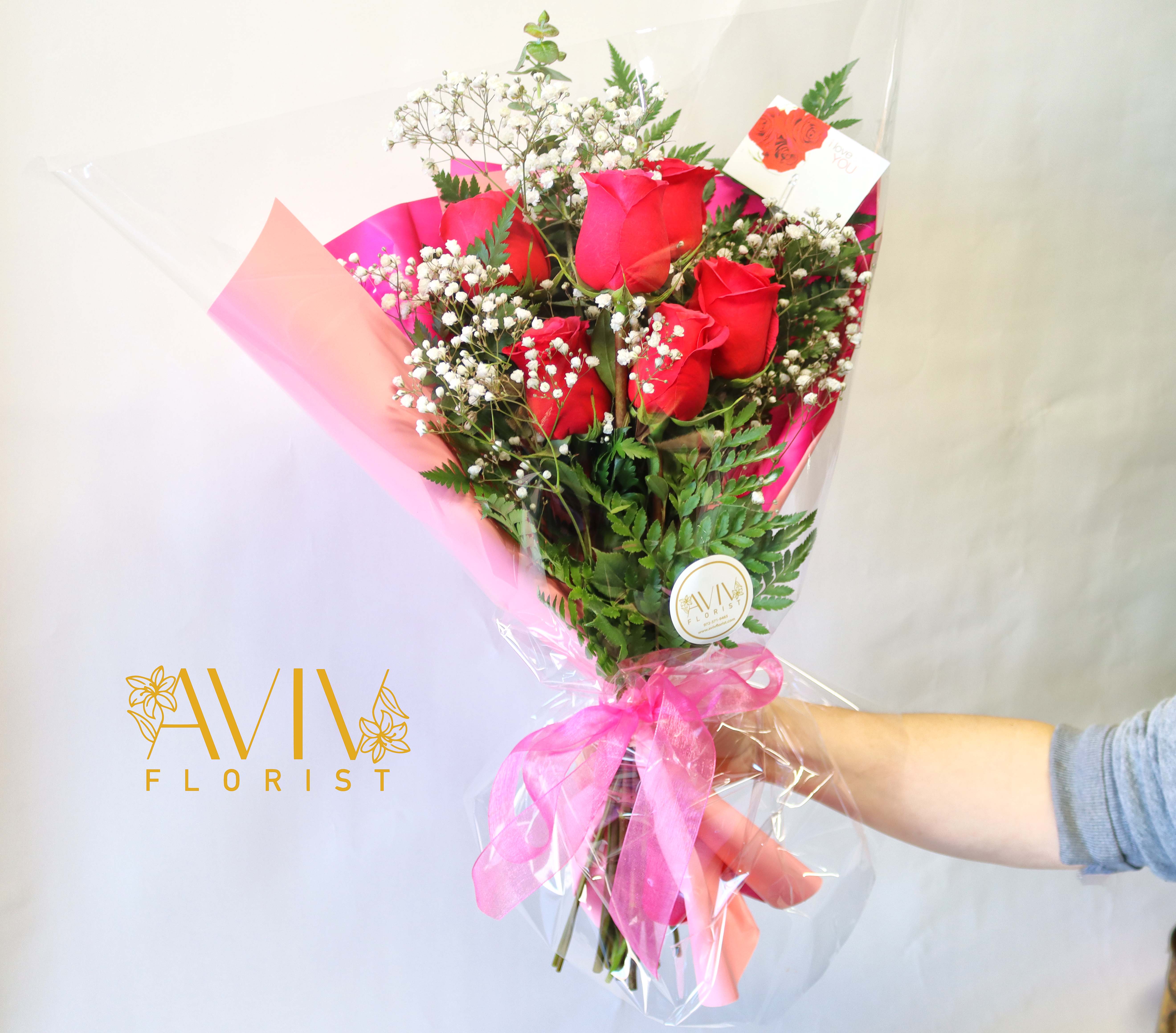 Love 6 roses Wrap - Express your sincere love with our beautiful AVIV Florist signature red or pink roses wrap arrangement designed for that great moment.