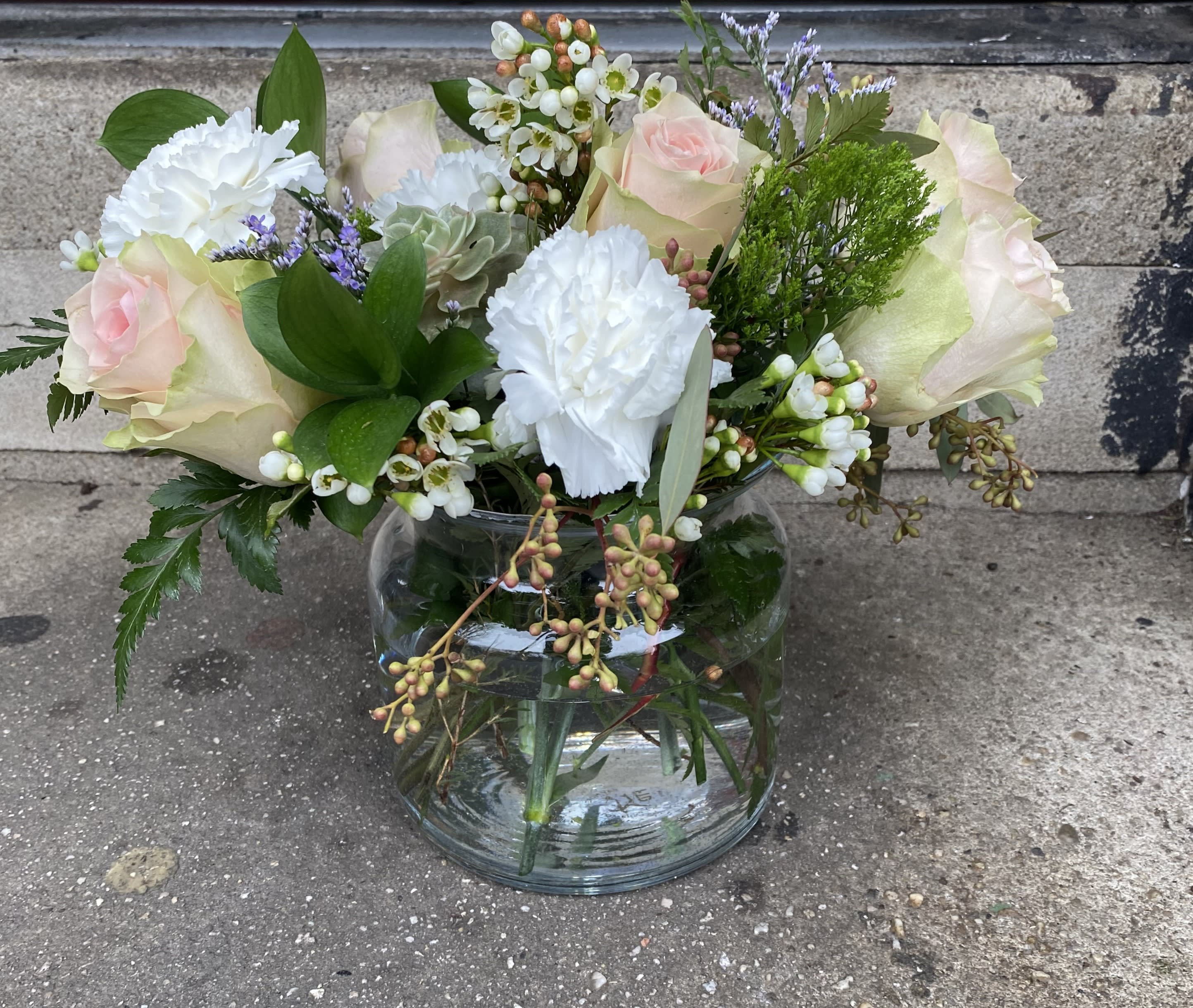 I LOVE YOU Softly Bouquet - A petite bouquet of soft pink roses, white carnations, limonium, succulent, israeli ruskus, seeded eucalyptus, and wax flower. All arranged in a beautiful glass vase. 